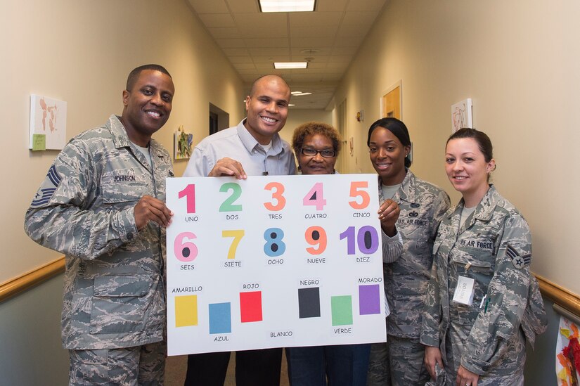 Members of the Joint Base Charleston Multicultural Committee pose for a photo Oct. 7, 2014, at the Child Development Center on Joint Base Charleston, S.C. Committee members read Spanish to children at the CDC  in celebration of Hispanic Heritage Month, which runs through Oct. 15. The Multicultural Committee's mission is to enhance cross-cultural awareness and to promote diversity among all military members, civilian employees, family members and retirees. (U.S. Air Force photo/Senior Airman George Goslin)