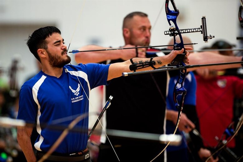 U.S. Air Force athlete Daniel Crane aims at his target in an archery qualification round during the 2014 Warrior Games Oct. 1, 2014, at the U.S. Olympic Training Center in Colorado Springs, Colorado. The Warrior Games consist of athletes from the Defense Department, who compete in Paralympic-style events for their respective military branch. The goal of the games is to help highlight the potential of warriors through competitive sports. (U.S. Air Force photo/Airman 1st Class Scott Jackson)