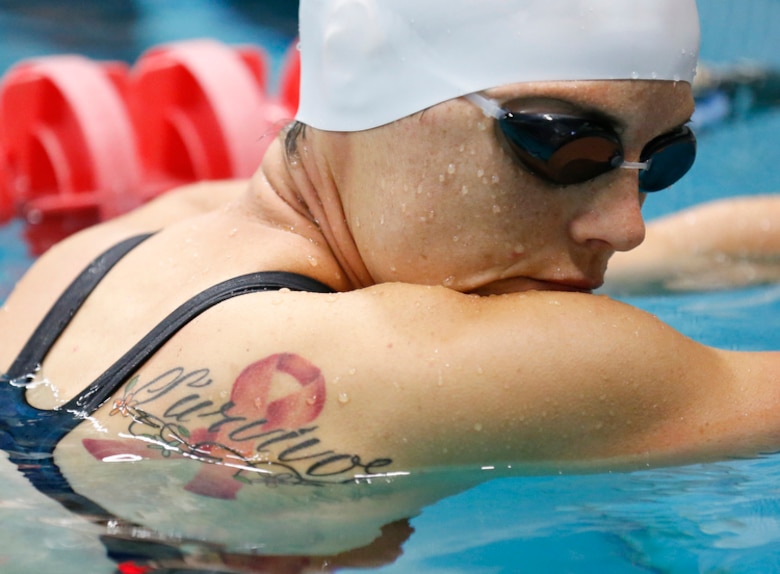 U.S. Air Force Tech. Sgt. Lara Ishikawa warms up in the pool before the start of the championship swim events at the 2014 Warrior Games in Colorado Springs, Colorado, on Tuesday, Sept. 30, 2014. Ishakawa is a cancer survivor and a competitor in the Ultimate Champion, a pentathlon-style event. (Courtesy photo/Mike Morones)
