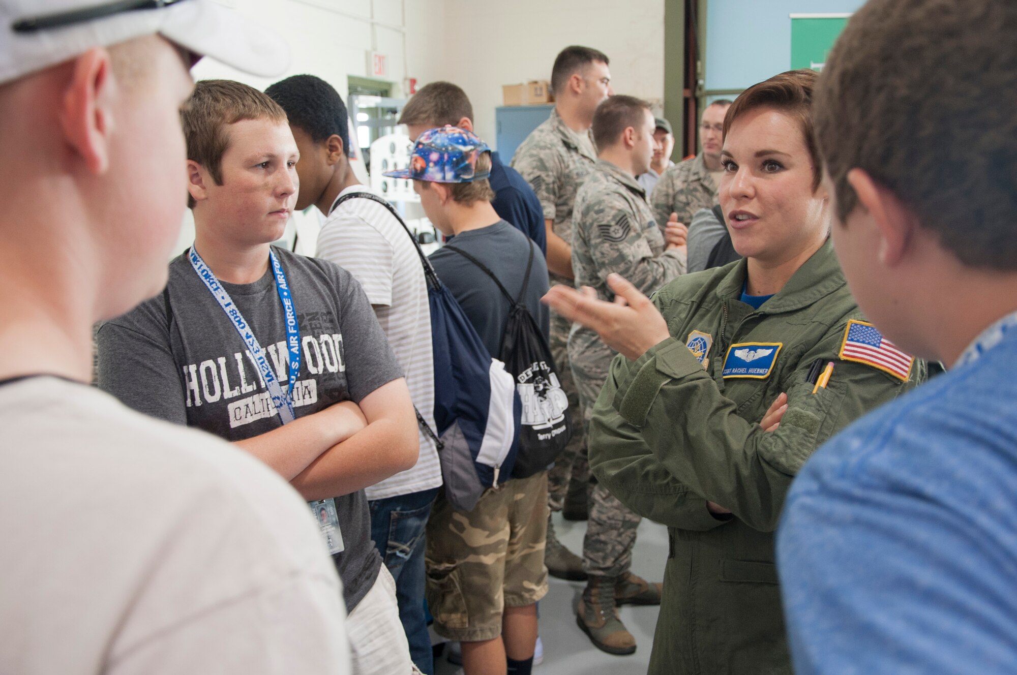 Staff Sgt. Rachel Huebner, 436th Airlift Wing protocol specialist, talks with juniors and seniors from local high schools during the Aviation Education Day October 3, 2014, at the Sussex County Airport in Georgetown, Del.  More than 150 students attended the event that focused on introducing young people to the vast array of aviation industry career opportunities. (U.S. Air Force photo/Senior Airman Jared Duhon)