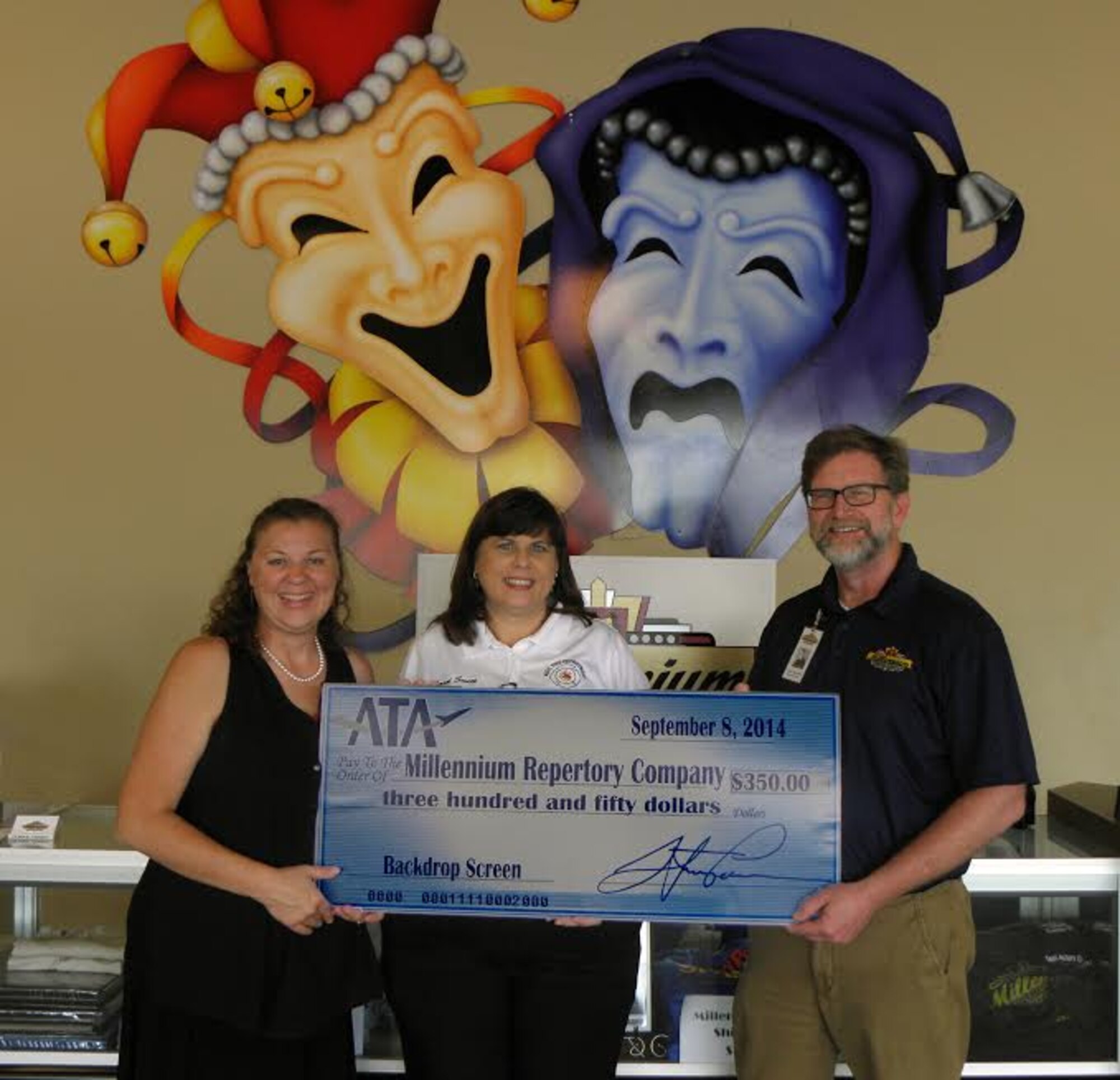 The Employee and Community Activities Committee (E&CAC) of Aerospace Testing Alliance (ATA) presented a donation of $350 to the Millennium Repertory Company (MRC). MRC is the resident theater group at the Manchester Arts Center located in downtown Manchester. The funds will be used by the MRC to purchase a multipurpose projector and backdrop screen to be used onstage during performances. Pictured are ATA E&CAC members (left to right) Mary Beth Barlow and Carol Smith presenting the donation to MRC managing director Noel Clements. (Photo provided)