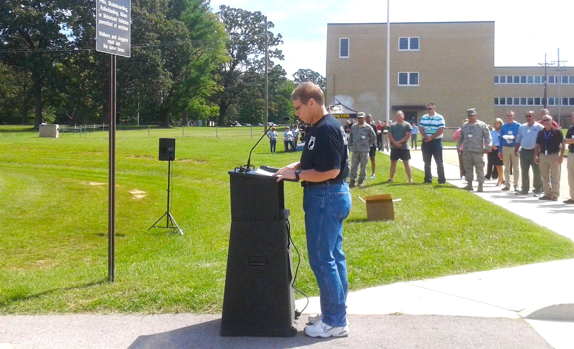 Bill Gonce, with the AEDC Financial Management and Comptroller Division, conducts the Missing Man Table and Honors Ceremony at the POW/MIA Remembrance Run/Walk and Burger Burn at AEDC on Sept. 17. The remembrance event was held as part of the POW/MIA Recognition Day. IAW DODI 5040.02 Ecl. 10, a portion of this image has been masked as part of our security posture. The image containing the masked portion is approved for public release. (Photo by Rhonda Ward)