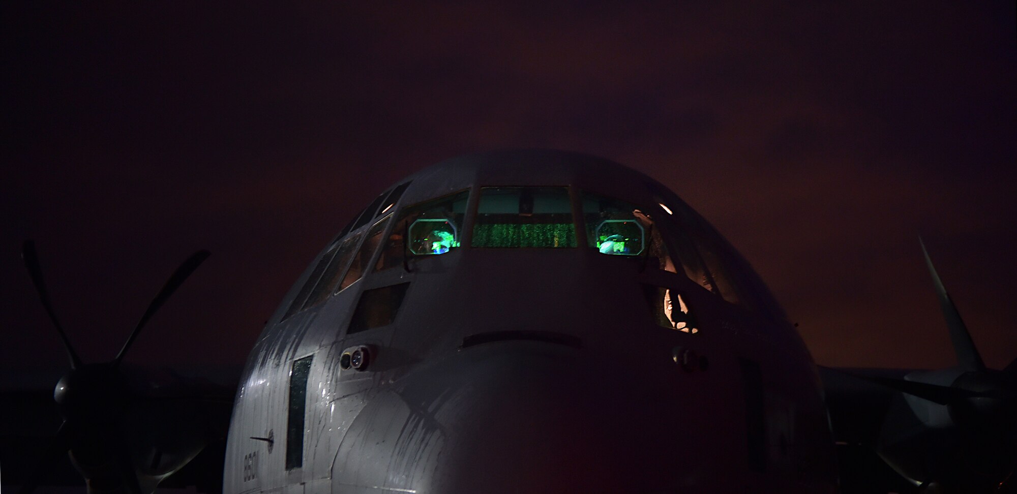 U.S. Air Force Capt. Brian Shea and Capt. Joe Eastman, pilots with the 37th Airlift Squadron prepare to fly the first mission from the 37th AS into Liberia, to assist with Operation UNITED ASSISTANCE Oct. 7, 2014, at Ramstein Air Base, Germany. As the Ebola outbreak becomes a potential global threat, U.S. Africa Command is working in support of the U.S. Agency for International Development, the lead federal agency (LFA), as part of a comprehensive U.S. Government effort to respond to and contain the outbreak of the Ebola virus in West Africa as quickly as possible.  This was the first C-130J Super Hercules flight launched from Ramstein to Monrovia, Liberia in support of OUA. (U.S. Air Force photo by/Staff Sgt. Sara Keller)