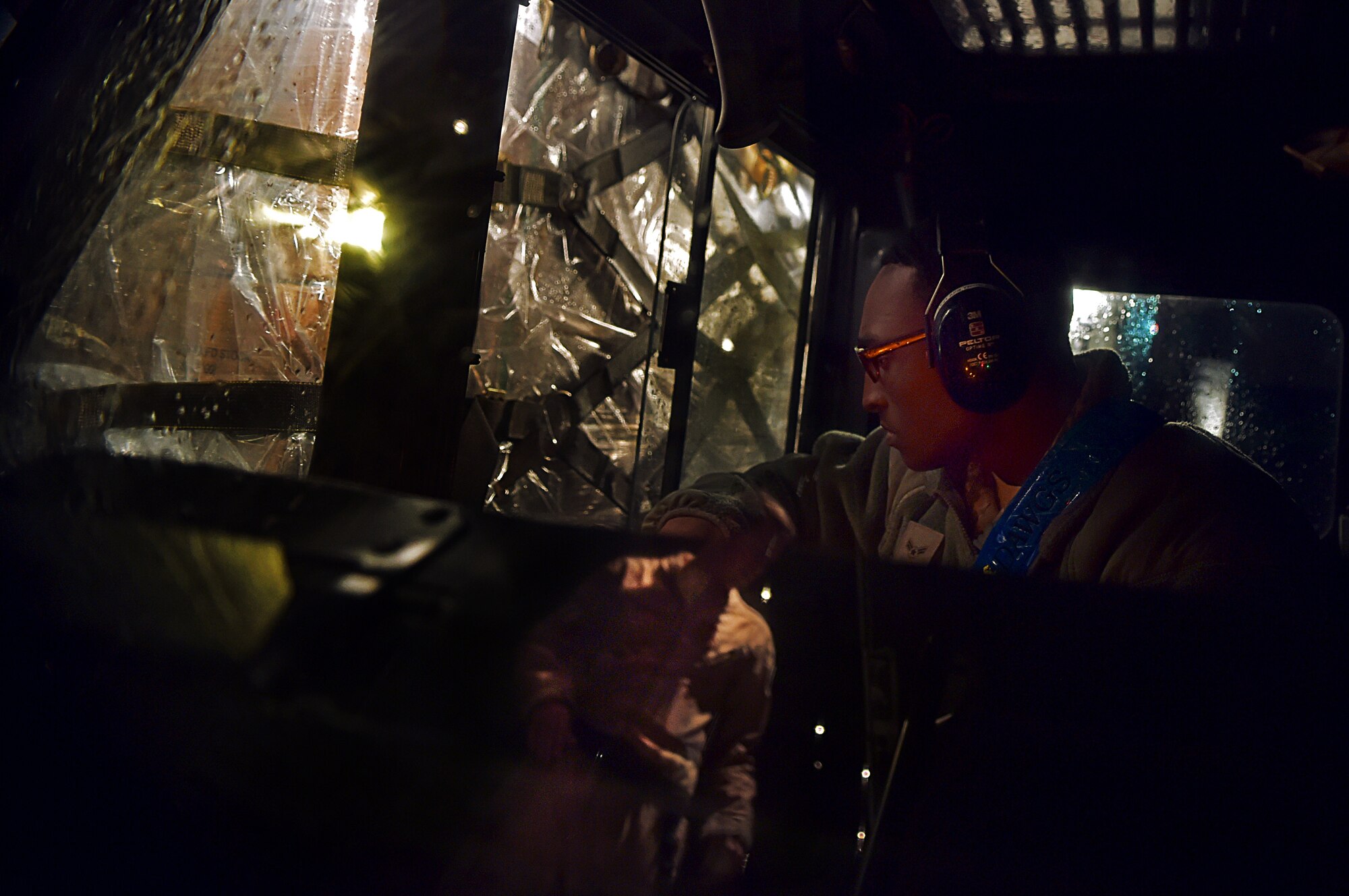 Airman 1st Class Michael Taylor, an air transporter with the 721st Aerial Port Squadron, assists Senior Airman Christian McDevitt, load master with the 37th Airlift Squadron, in loading cargo onto a C-130-J Super Hercules prior to a mission in support of the Ebola virus epidemic, Oct. 7, 2014, at Ramstein Air Base, Germany. As the Ebola outbreak becomes a potential global threat, U.S. Africa Command is working in support of the U.S. Agency for International Development, the lead federal agency (LFA), as part of a comprehensive U.S. Government effort to respond to and contain the outbreak of the Ebola virus in West Africa as quickly as possible.  This was the first C-130J Super Hercules flight launched from Ramstein to Monrovia, Liberia in support of Operation UNITED ASSISTANCE. (U.S. Air Force photo by/Staff Sgt. Sara Keller