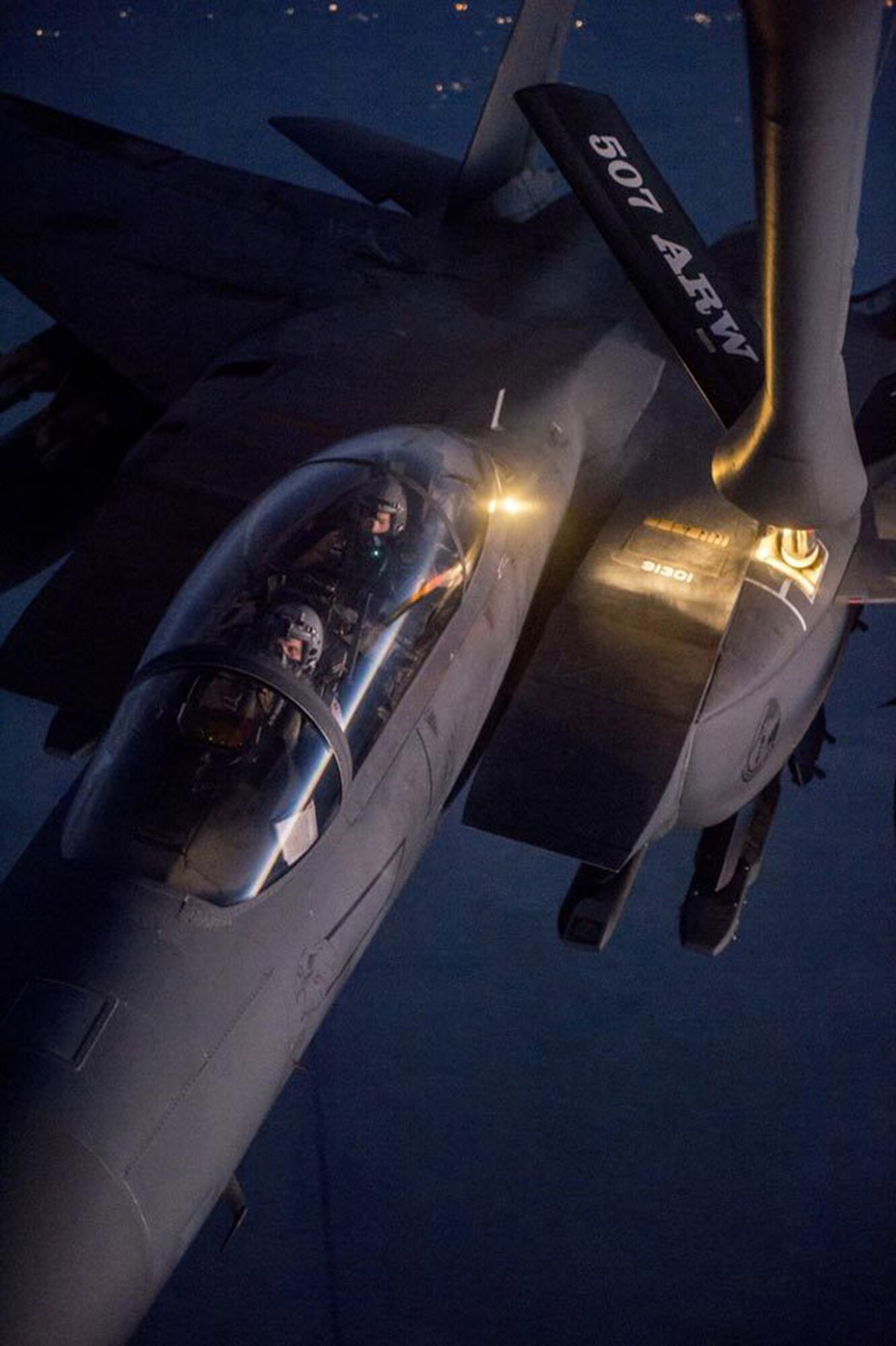 A U.S. Air Force F-15E Strike Eagle receives fuel from a KC-135R Stratotanker from the 507th and 137th Air Refueling Wing over northern Iraq after conducting airstrikes in Syria, Sept. 23, 2014.These aircraft were part of a large coalition strike package that was the first to strike ISIL targets in Syria. (U.S. Air Force photo by Senior Airman Matthew Bruch/Released)
