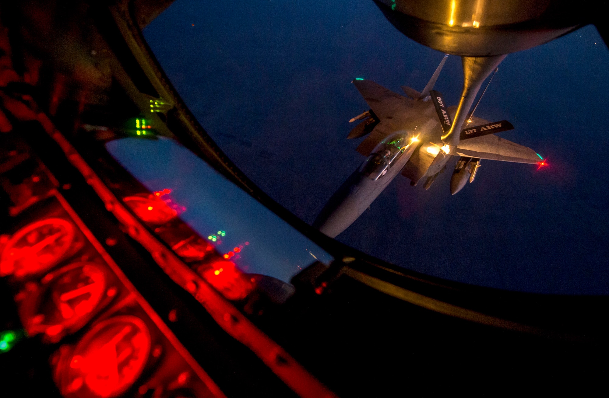 A U.S. Air Force F-15E Strike Eagle receives fuel from a KC-135R Stratotanker from the 507th and 137th Air Refueling Wing over northern Iraq after conducting airstrikes in Syria, Sept. 23, 2014.These aircraft were part of a large coalition strike package that was the first to strike ISIL targets in Syria. (U.S. Air Force photo by Senior Airman Matthew Bruch/Released)
