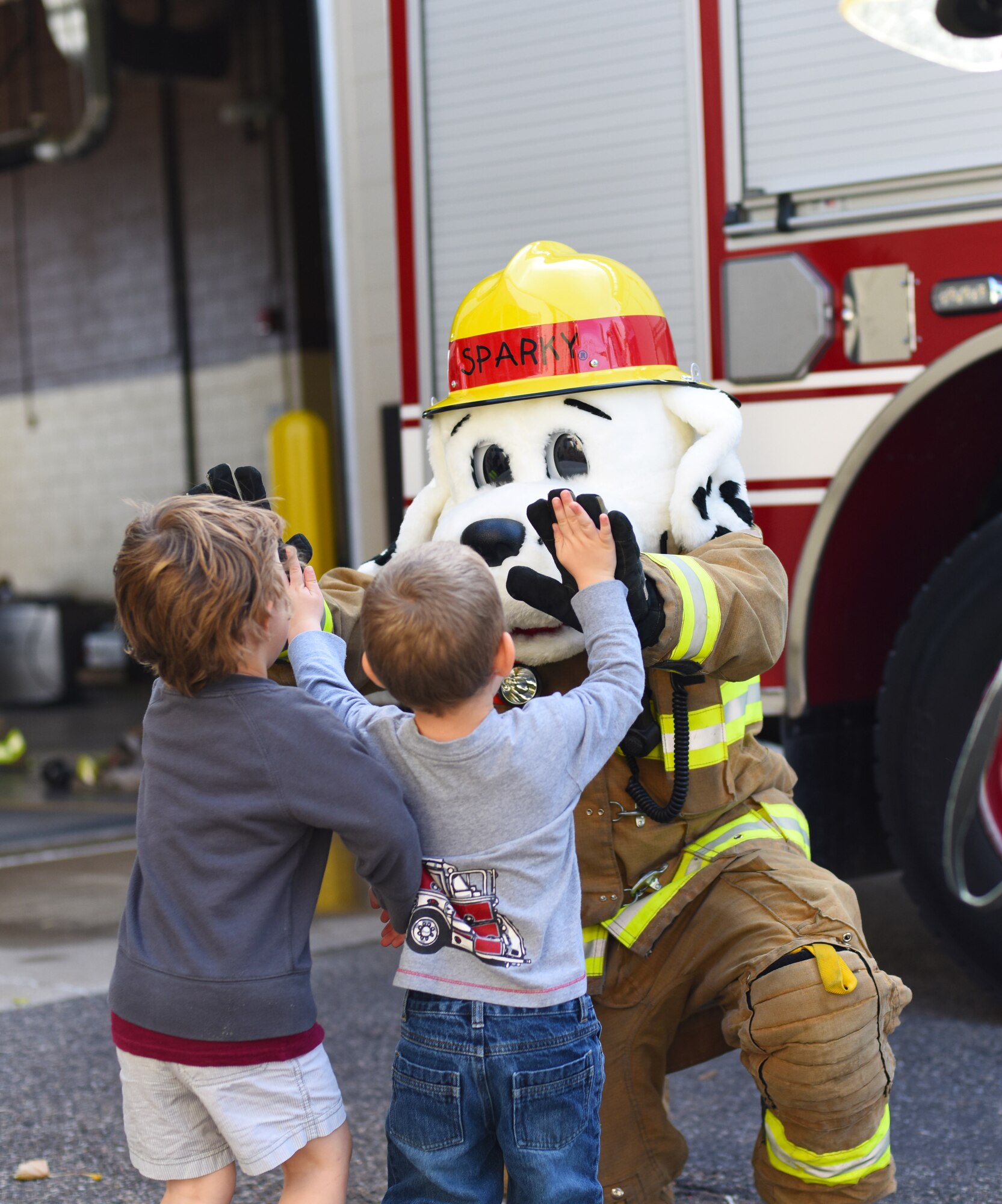 Children high five Sparky the Fire Dog while on a tour of Malmstrom Air Force Base’s fire department during Fire Prevention Week Oct. 6. The weeklong event runs through Oct. 11 and includes fire educational displays, a fire muster competition and a parade. Look for more photos of the weeklong event in next week’s edition of the Global Guardian. A list of events can be found at http://www.malmstrom.af.mil/ (U.S. Air Force photo/Airman 1st Class Collin Schmidt)