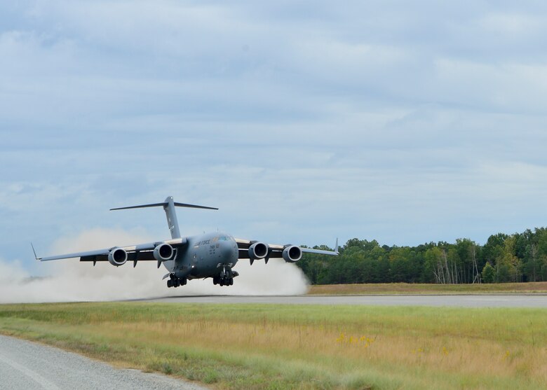 A C-17 Globemaster III performs a touch and goes during semi-prepared runway operations, or SPRO training Sept. 24, 2014, at Fort A.P. Hill, Va. SPRO training prepares aircrews to operate the aircraft on austere runway conditions while operating in deployed environments. (U.S. Air Force photo/Airman 1st Class William Johnson)