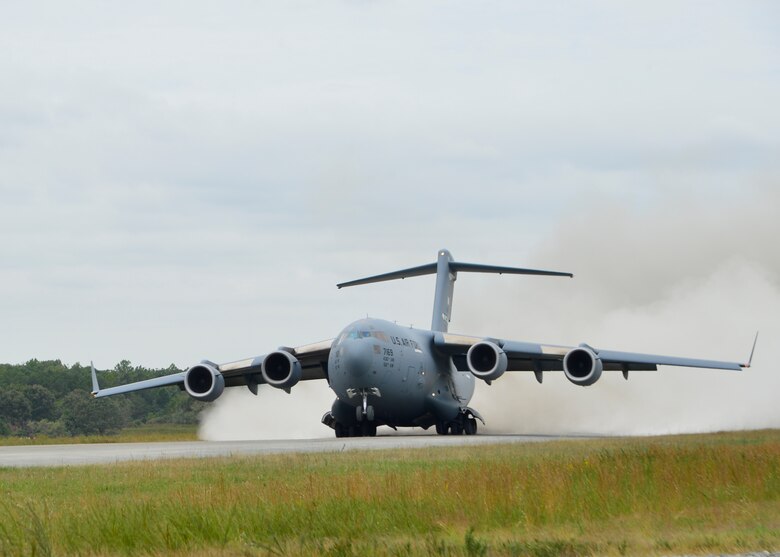 A C-17 Globemaster III from the 3d Airlift Squadron takes off on a dirt and gravel assault strip during semi-prepared runway operations, or SPRO training  Sept. 24, 2014, at Fort A.P. Hill, Va. One of the C-17’s unique capabilities is its ability to land and take off on short semi-prepared runways. (U.S. Air Force photo/Airman 1st Class William Johnson) 