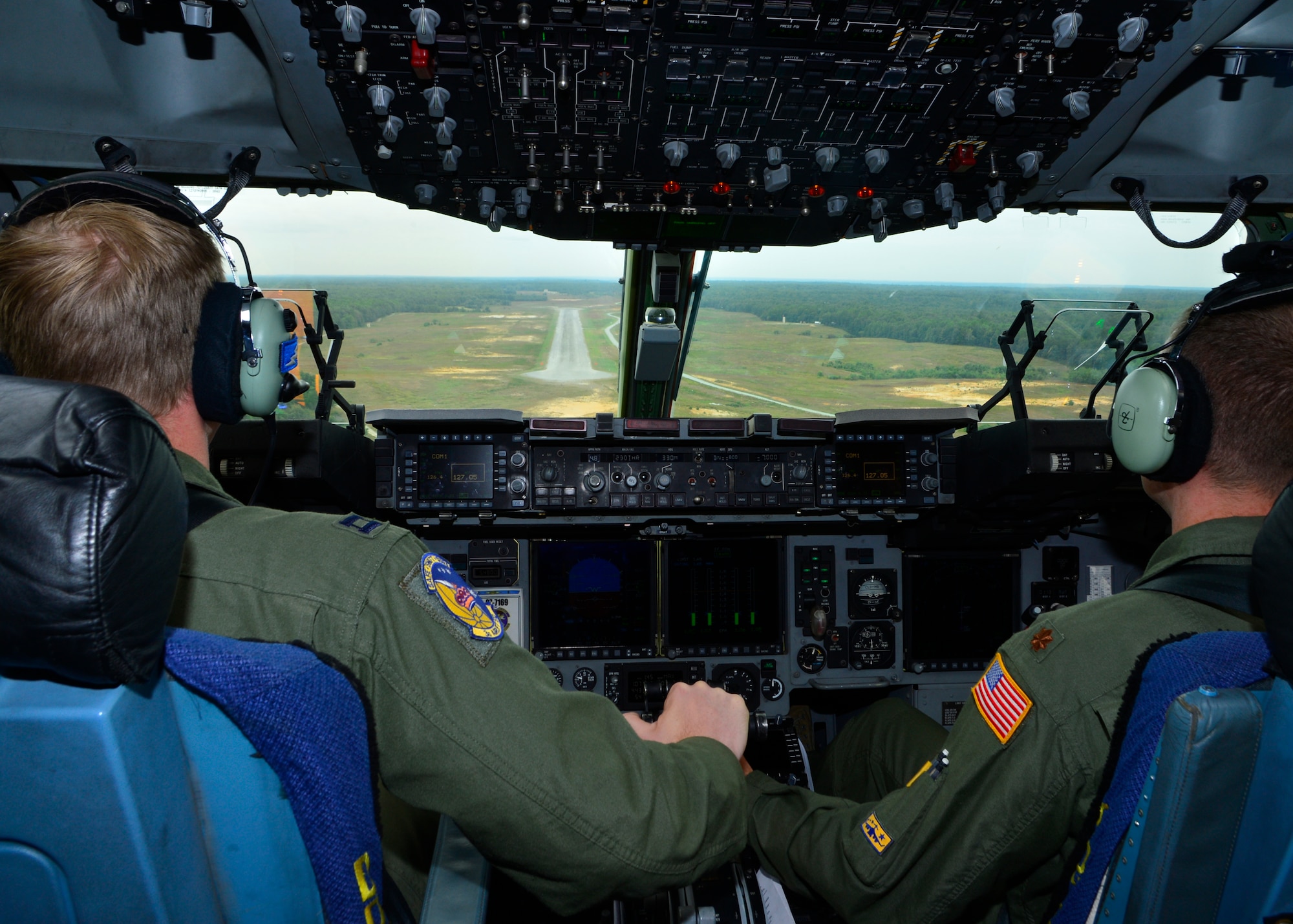 Capt. Conor Murphy, 3d Airlift Squadron chief of awards and decorations, and Maj. Aaron Oelrich, 3d AS director of operations, prepare to perform a touch and go during the semi-prepared runway operations, or SPRO training, Sept. 24, 2014, at Fort A.P. Hill, Va. The crew performed multiple touch and goes and short landings on Fort A.P. Hill’s 3,563 foot dirt and gravel runway in a C-17 Globemaster III. (U.S. Air Force photo/Airman 1st Class William Johnson)