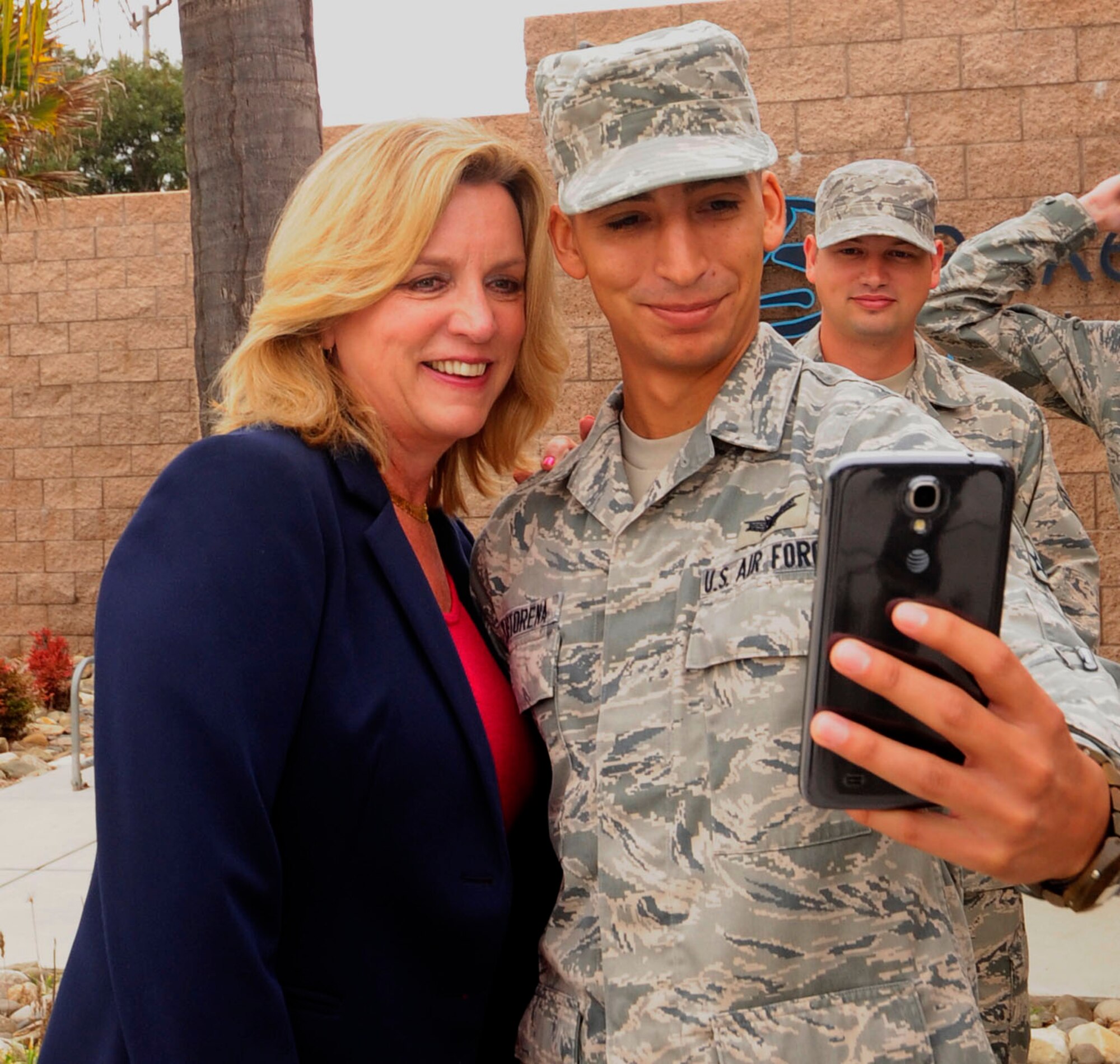 Airmen have the opportunity to take a couple of selfies with Secretary of the Air Force, Deborah Lee James during her visit Sept. 24, 2014, Vandenberg Air Force Base, Calif. The Secretary also gathered with Airmen for a group photo after a meet and greet breakfast. (U.S. Air Force photo by Tech. Sgt. Tyrona Lawson/Released) 


