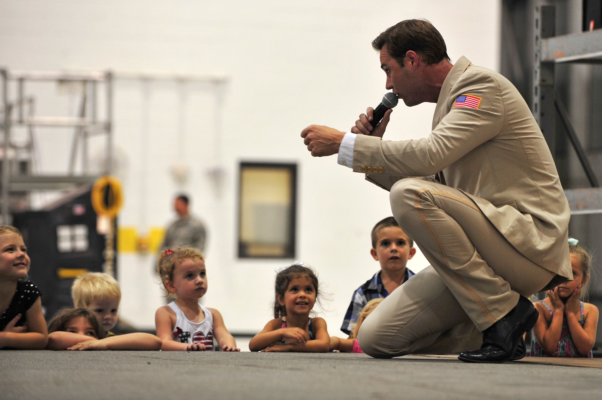 Michael Mulligan, United Service Organizations Show Troupe performer, sings during a performance at Seymour Johnson Air Force Base, North Carolina, Oct. 3. The Show Troupe, made up of five singers and a support team, provided an hour-long set for members of Team Seymour. They annually perform musical entertainment for more than 600,000 service members and families across the globe. (U.S. Air Force photo/Senior Airman John Nieves Camacho)