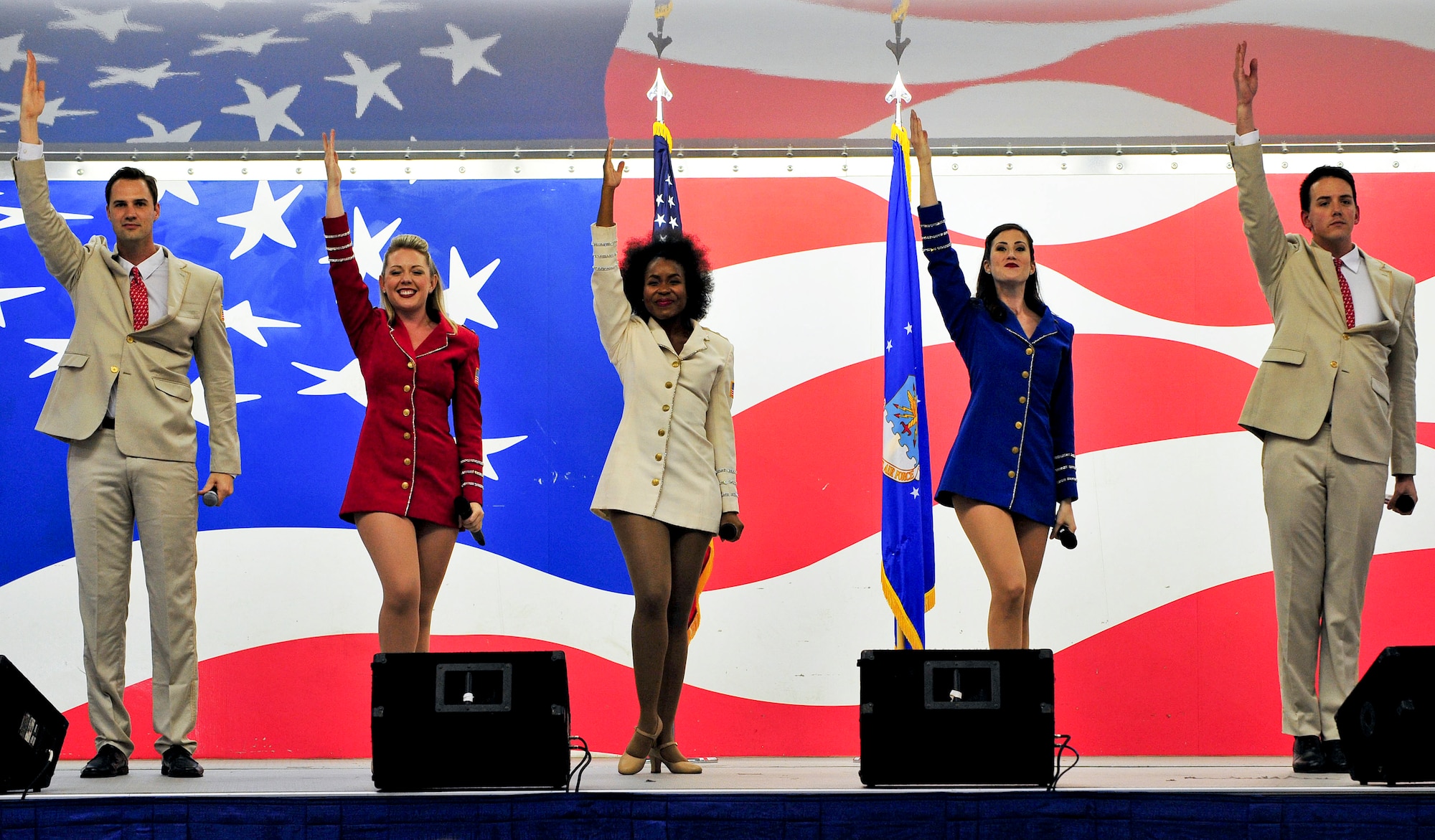 Performers from the United Service Organizations Show Troupe sing during a performance at Seymour Johnson Air Force Base, North Carolina, Oct. 3. The Show Troupe, made up of five singers and a support team, provided an hour-long set for members of Team Seymour. They annually perform musical entertainment for more than 600,000 service members and families across the globe. (U.S. Air Force photo/Senior Airman John Nieves Camacho)