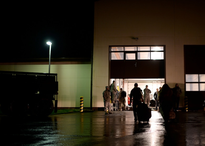 U.S. Air Force Airmen assigned to the 606th Air Control Squadron arrive at a processing point Oct. 7, 2014, at Spangdahlem Air Base, Germany, before their deployment to Southwest Asia in support of Operation Enduring Freedom. The squadron specializes in providing airspace control to both pilots and ground crew. (U.S. Air Force photo by Staff Sgt. Daryl Knee/Released)