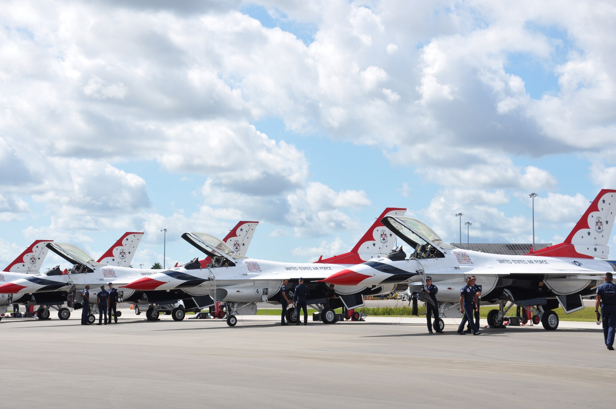 Members of the U.S. Air Force Thunderbirds make final preparations before conducting their practice performance, as part of events leading up to the Melbourne Air & Space Show, Melbourne, Fla., Oct. 3, 2014. Millions of people have witnessed the Thunderbirds demonstrations, and in turn, have seen the pride, professionalism and dedication of hundreds of thousands of Airmen serving at home and abroad. (U.S. Air Force photo/Shawn M. Walleck) (Released)