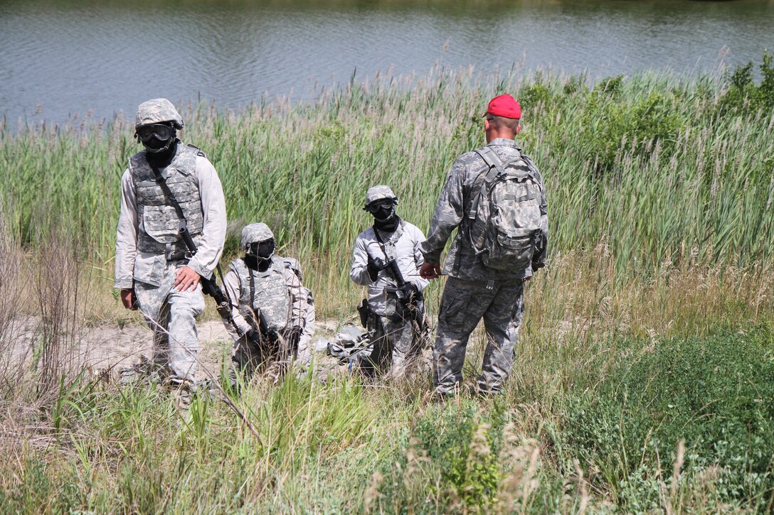 Air Force Reserve Command reservists from the 932nd Airlift Wing gather to hear their preliminary instructions as they head uphill. The 932nd Security Forces Squadron members listened to land navigation instructions before heading out into the field under a red hat instructor.  A variety of skills and safety cautions were focused on during the two day event which was conducted under the 932nd Mission Support Group banner. (U.S. Air Force photo/Tech. Sgt. Christopher Parr) 
