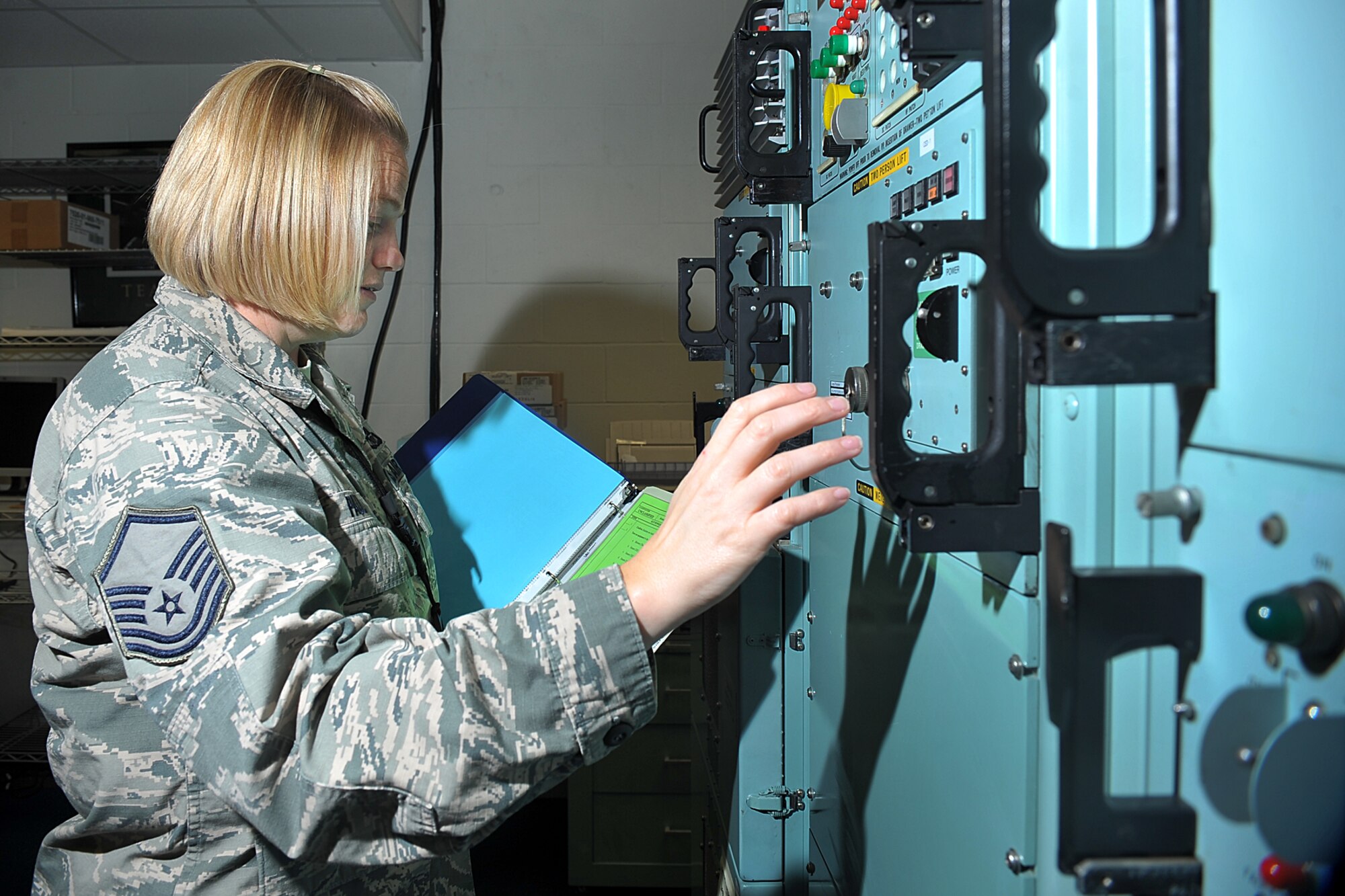 U.S. Air Force Master Sgt. Ericka Pauly, 625th Strategic Operations Squadron, shuts down the Strategic Automated Command Control System subnet communication processor at their headquarters facility on Offutt Air Force Base, Neb., Oct. 3, 2014. The 625th STOS offers various airborne and ground-based capabilities, including intercontinental ballistic missile targeting nuclear command, control and communication and an aerial ICBM launch capability, which enhances the strategic deterrence of the U.S. nuclear triad. (U.S. Air Force Photo by Charles Haymond)