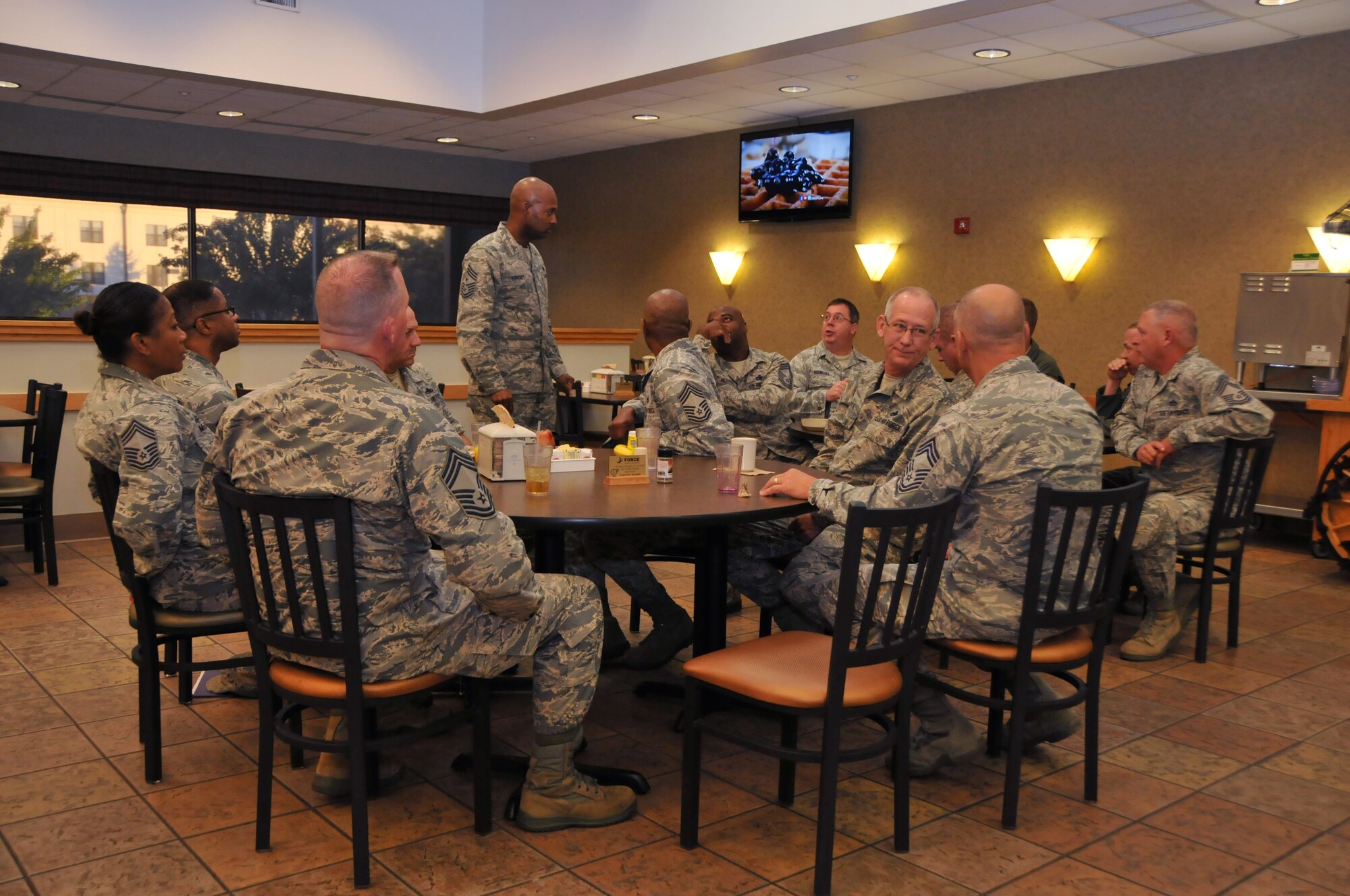 Chief Master Sgt. Cameron Kirksey, Air Force Reserve Command command chief, has breakfast with 403rd Wing chiefs during his visit to Keesler, Air Force Base. (U.S. Air Force photo/Senior Airman Nicholas Monteleone)