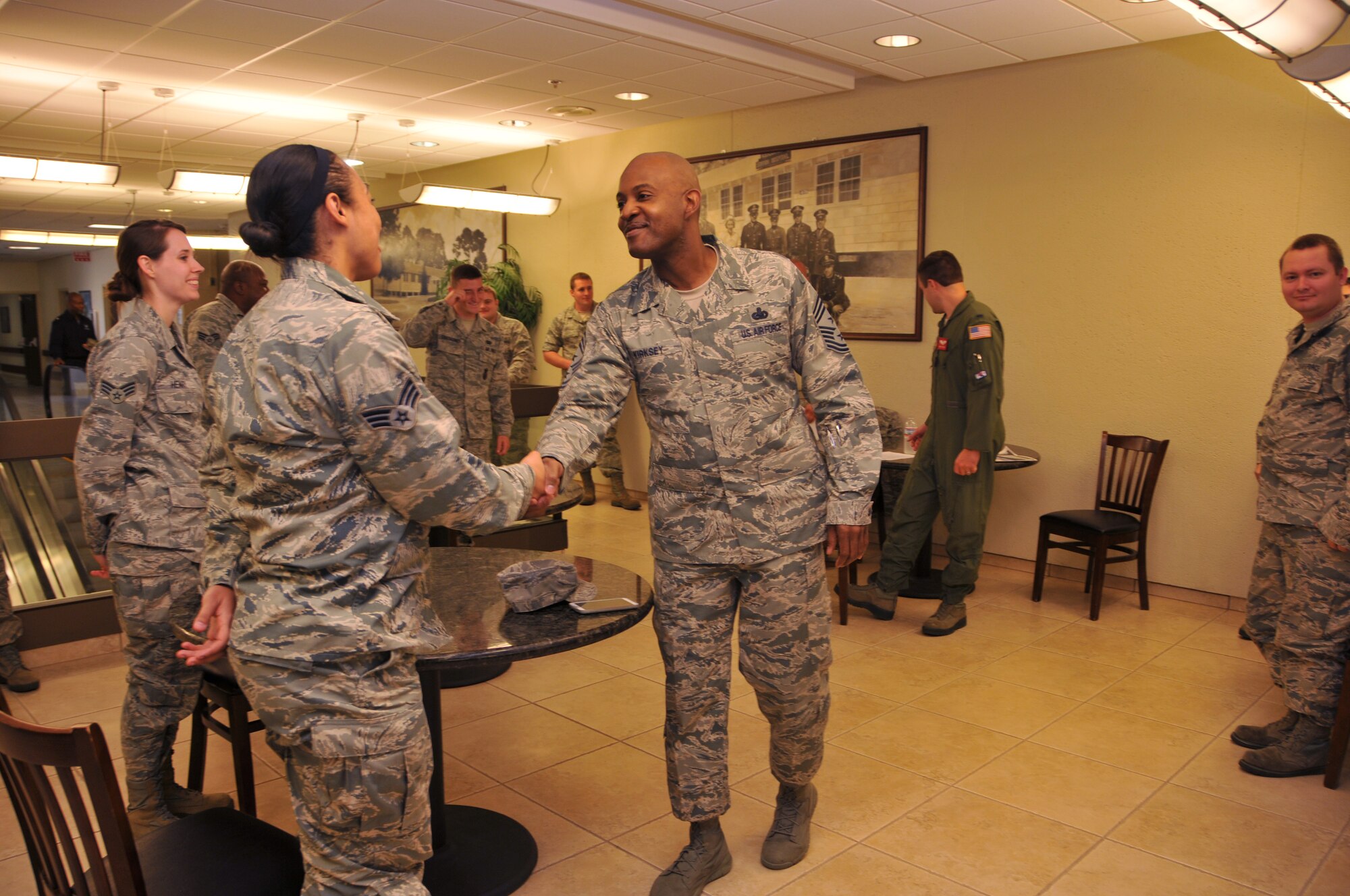 Chief Master Sgt. Cameron Kirksey, Air Force Reserve Command command chief, meets members of the 403rd WG during his visit to Keesler, AFB. (U.S. Air Force Photo/Senior Airman Nicholas Monteleone)
