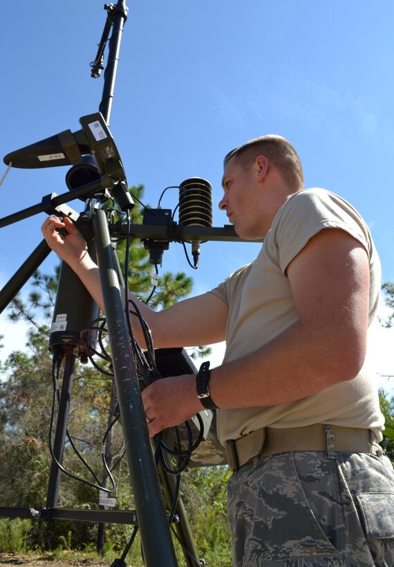 Staff Sgt. Nicholas Mistisshen, a weather forecaster with the 159th Weather Flight, disassembles weather monitoring equipment during a Field Training Exercise Oct. 4, 2014 at the Camp Blanding Joint Training Center, Starke Fla.Staff Sgt. The FTX provided colaborative trainign between the 159th Weather Flight and the 290th Joint Communications Support Squadron. (U.S. Air National Guard photo by Tech. Sgt. William Buchanan) (U.S. Air National Guard photo by Tech. Sgt. William Buchanan)