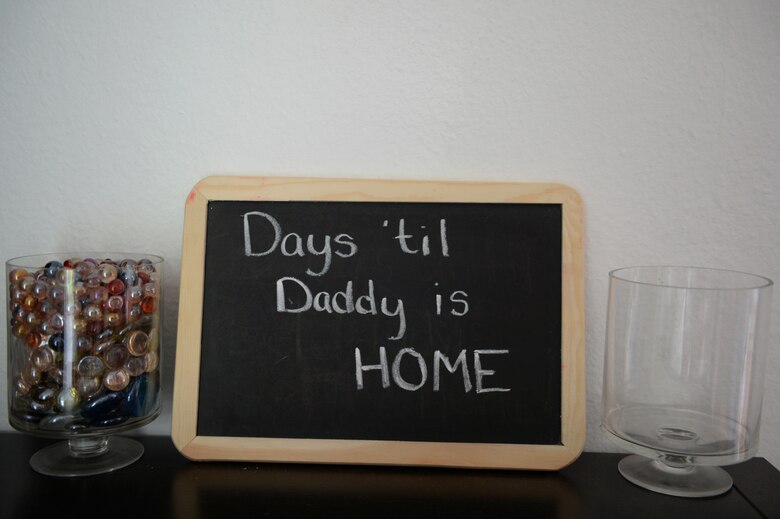 A countdown display sits on a table Oct. 6, 2014, at the Macri family’s home. The family will move a marble from one jar to the other each day to keep track of how many days until U.S. Air Force Airman 1st Class Ryan Macri, 606th Air Control Squadron radio frequency transmission journeyman, returns home from deployment. (U.S. Air Force photo by Airman 1st Class Dylan Nuckolls/Released)