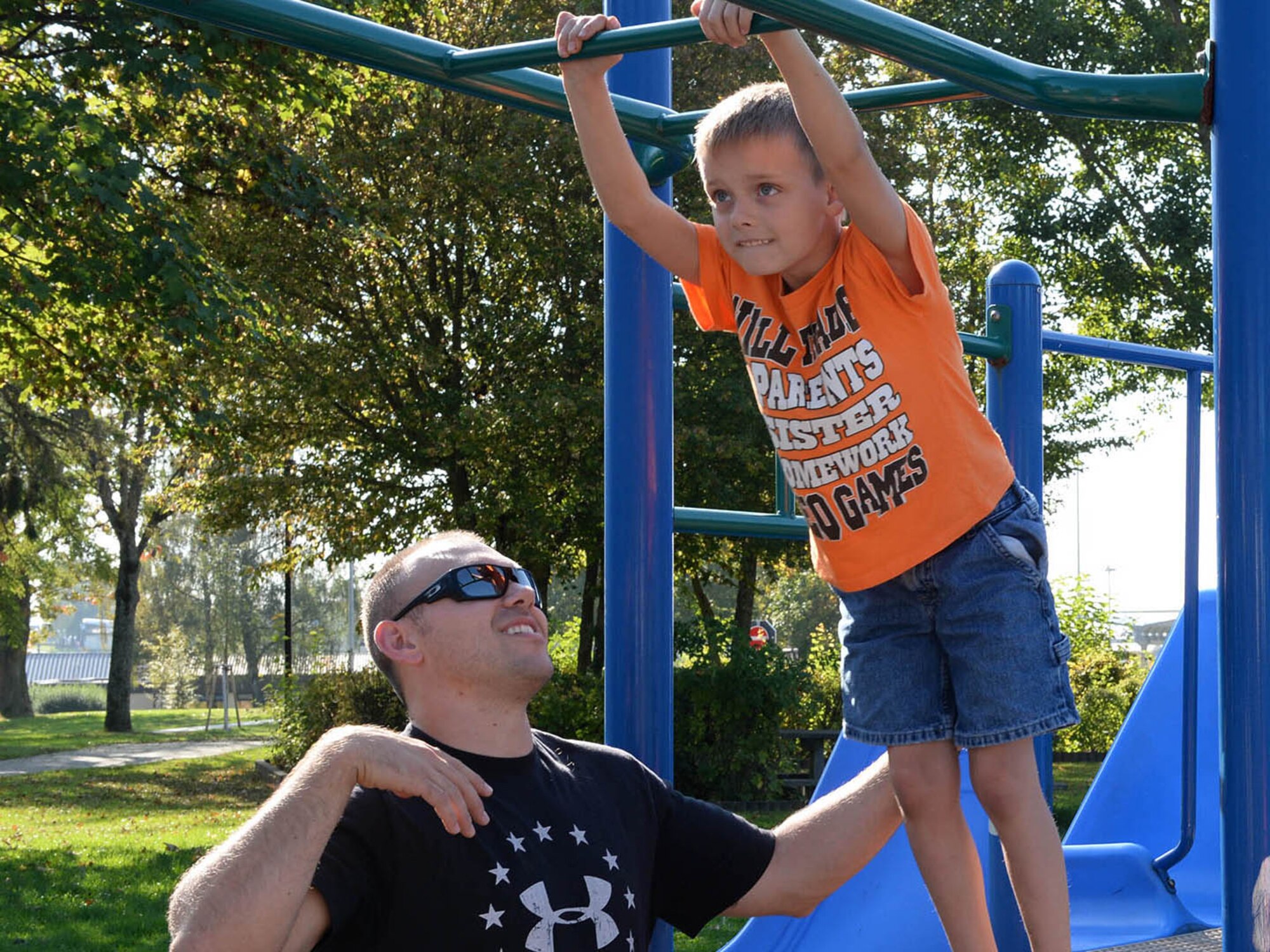 U.S. Air Force Airman 1st Class Ryan Macri, a 606th Air Control Squadron radio frequency transmission journeyman, spends time with his son Zachary Oct. 4, 2014, at a playground, at Spangdahlem Air Base, Germany.  The family spent several days together leading up to Ryan’s deployment. (U.S. Air Force photo by Airman 1st Class Dylan Nuckolls/Released)