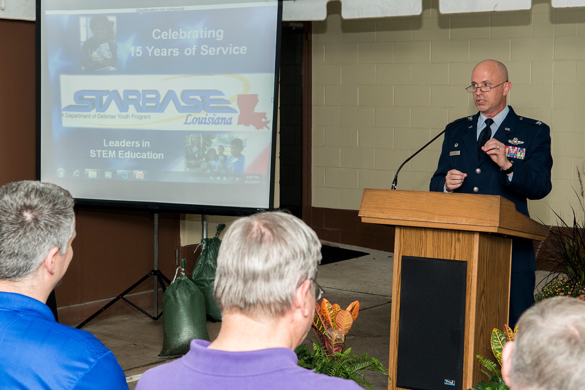 U.S. Air Force Col. Jonathan Ellis, 307th Bomb Wing (BW) commander, speaks during a STARBASE ceremony celebrating 15 years of service at Barksdale Air Force Base, La., Oct. 2, 2014. STARBASE is one of 70 national sties and is sponsored by the 307th BW of the Air Force Reserve Command. (U.S. Air Force photo by Master Sgt. Greg Steele/Released)