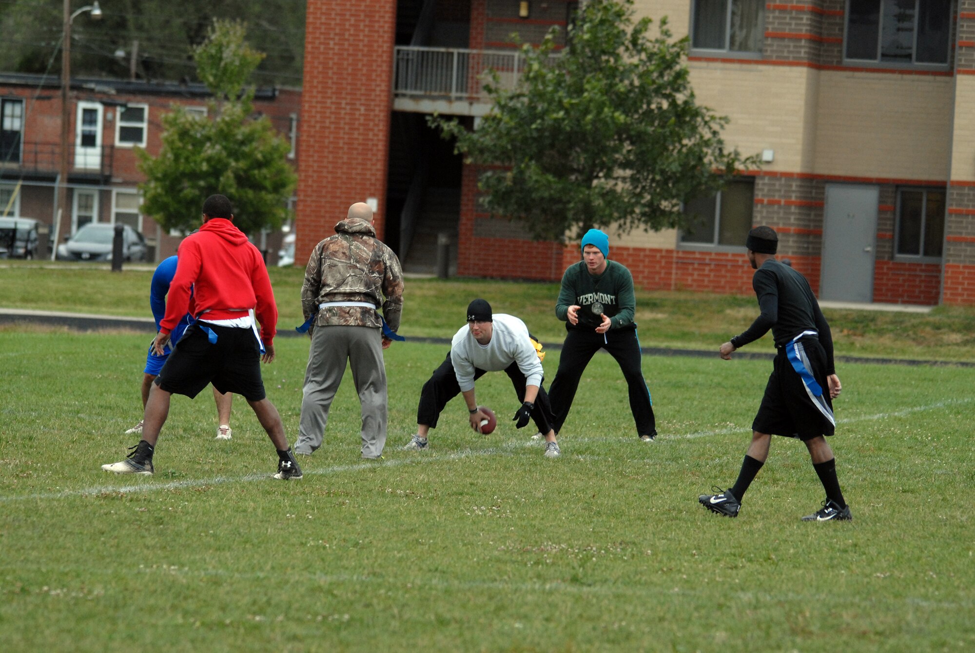 WRIGHT-PATTERSON AIR FORCE BASE, Ohio – The Flyers of the 89th Airlift Squadron battle the Cops from the 445th Security Forces Squadron during the Oct. 4, 2014, Battle of the Squads Flag Football game held outside of the Jarvis Gym here. Seven squadrons participated in the morale event the 445th Force Support Squadron Services Flight planned for the October unit training assembly. (U.S. Air Force photo/Tech. Sgt. Anthony Springer)
