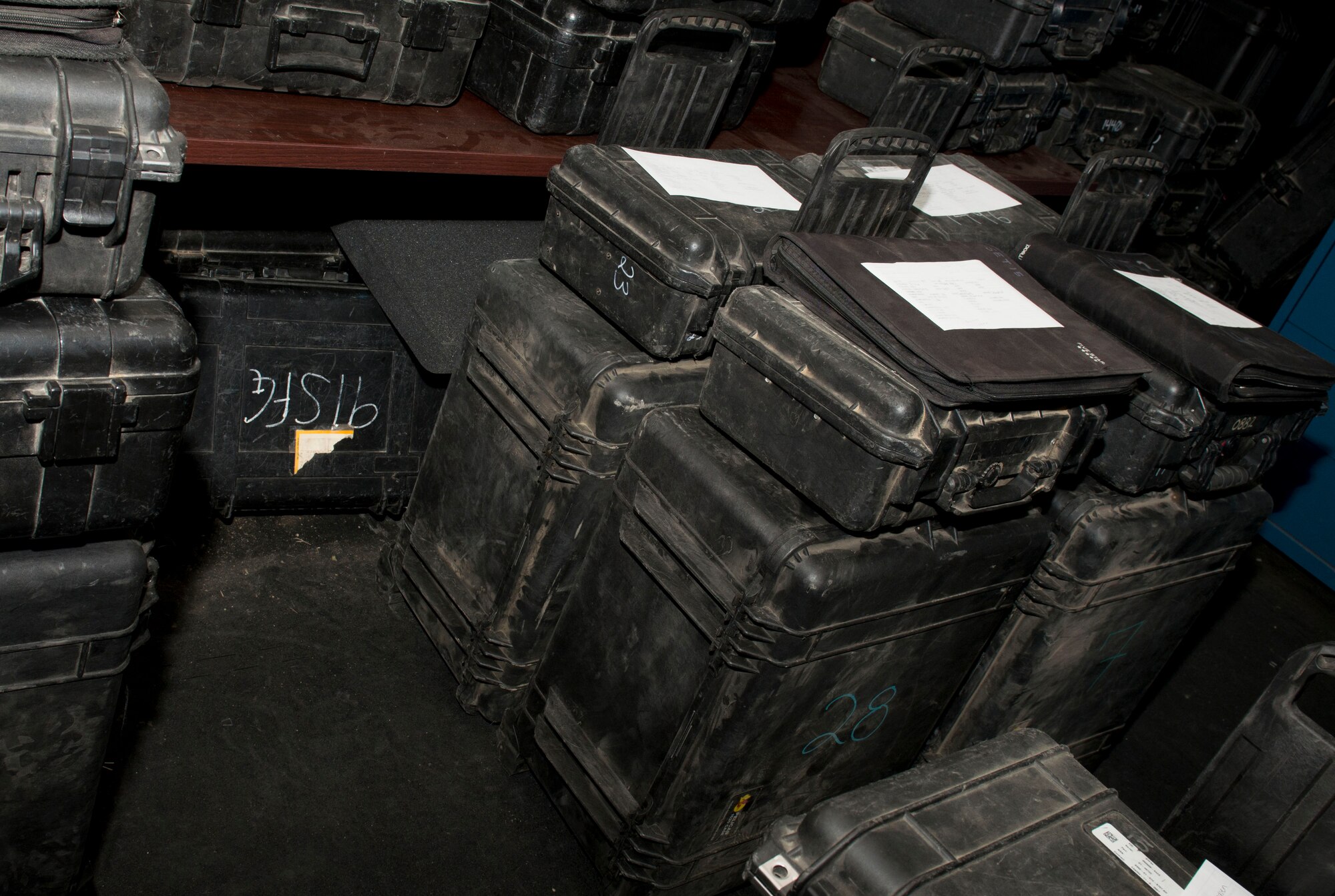 A collection of fully equipped trip boxes are prepared for dispatchers to give to security forces members before they leave for the missile complex on Minot Air Force Base, N.D., Sept. 29, 2014. Trip boxes contain mission essential equipment such as binoculars, a range finder, checklists, a personal alarm system, night vision goggles with magnifiers, and a booklet with guidelines for the field. (U.S. Air Force photo/Airman 1st Class Sahara L. Fales)