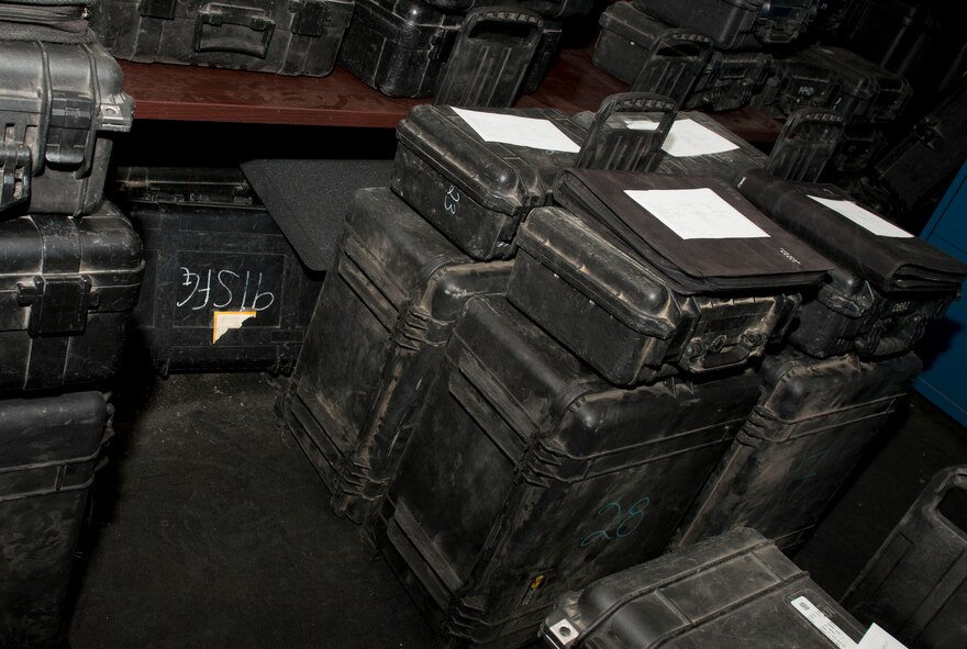 A collection of fully equipped trip boxes are prepared for dispatchers to give to security forces members before they leave for the missile complex on Minot Air Force Base, N.D., Sept. 29, 2014. Trip boxes contain mission essential equipment such as binoculars, a range finder, checklists, a personal alarm system, night vision goggles with magnifiers, and a booklet with guidelines for the field. (U.S. Air Force photo/Airman 1st Class Sahara L. Fales)