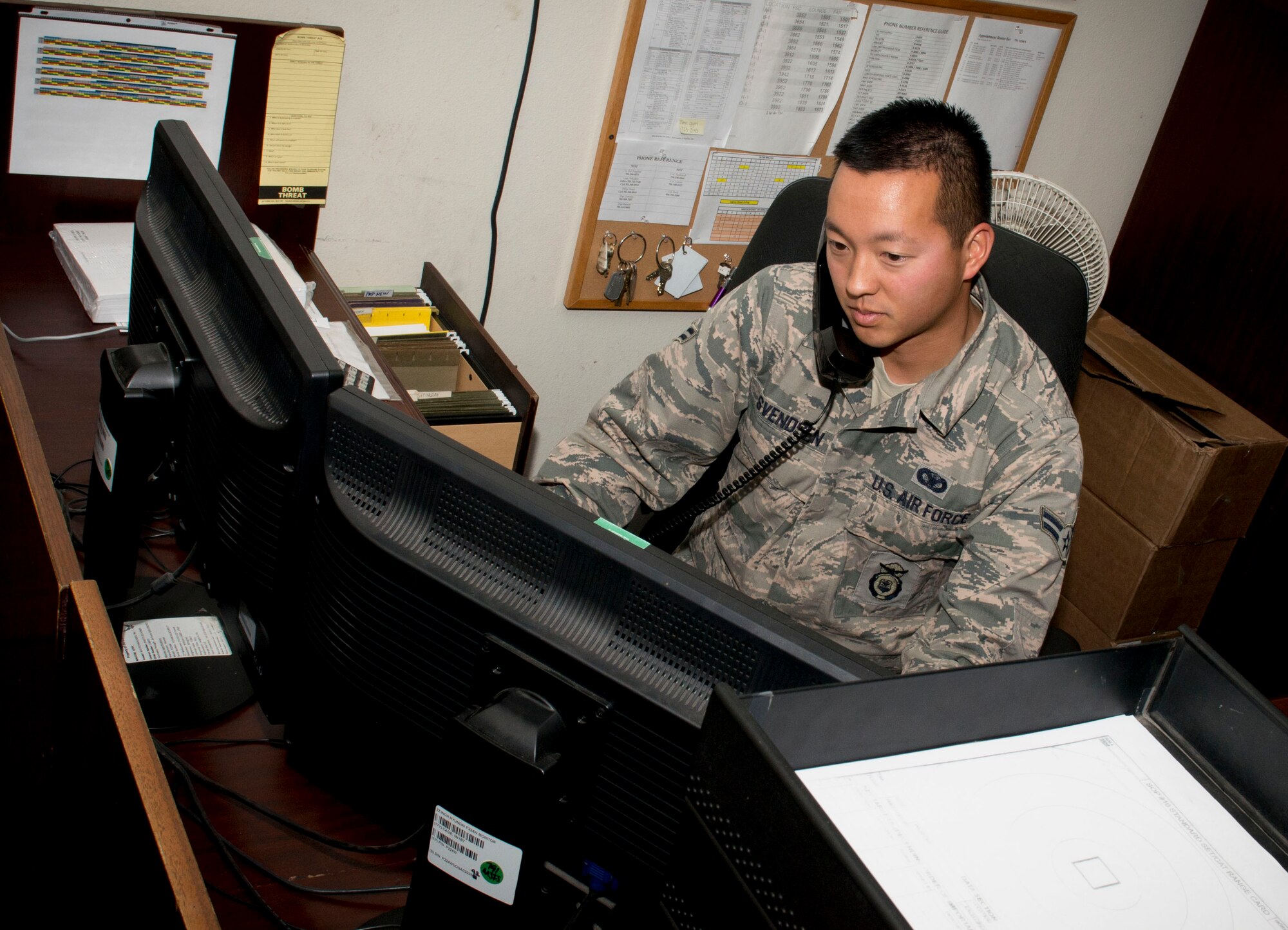 Airman 1st Class David Svendsen, 791st Missile Security Forces dispatcher, answers the phone on Minot Air Force Base, N.D., Sept. 29, 2014. Throughout the day, dispatchers are responsible for creating the necessary paperwork to log security forces members’ departure and keep track of their location while they are in the field. (U.S. Air Force photo/Airman 1st Class Sahara L. Fales)