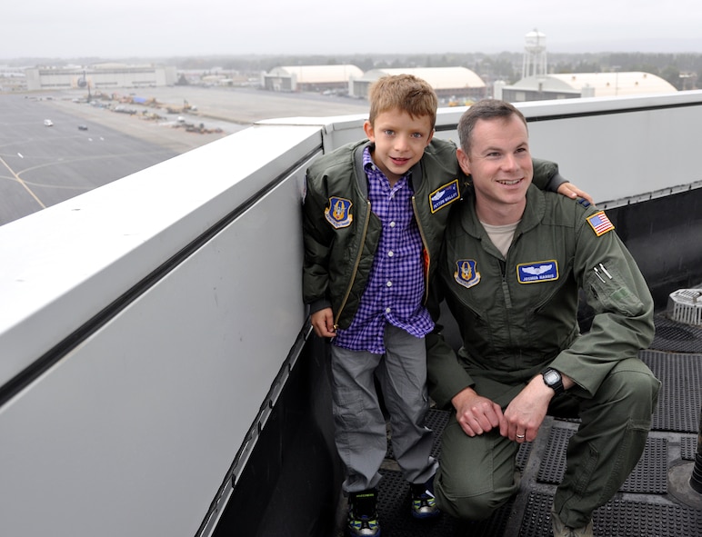 "Pilot for A Day" Peyton Malloy poses with Capt. Joshua Harris, 337th Airlift Squadron, while they tour the control tower Oct. 4, 2014 at Westover Air Force Reserve Base, Chicopee, Mass. “Pilot for a Day” is a program that provides high-spirited children like Peyton, who have serious or chronic conditions, and their families the unique opportunity to be guests of Westover and the U.S. Air Force. Peyton Malloy was accompanied by his mother Anne, father Robert, and sister Ashlyn. (U.S. Air Force photo/SrA. Monica Ricci)