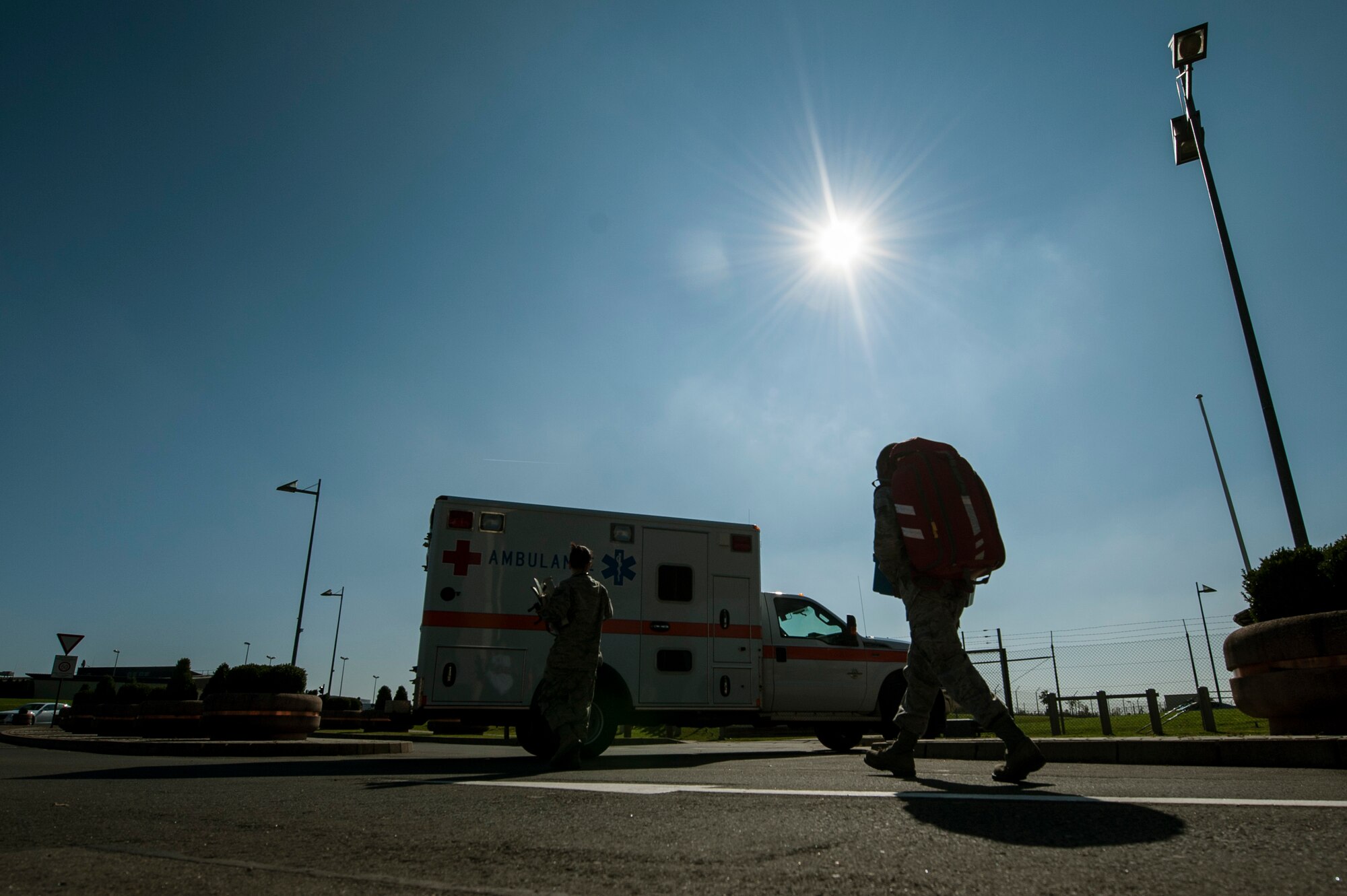 U.S. Air Force Tech. Sgt. Maria Pastoral and U.S. Air Force Senior Airman Henry Beauchamp, both 52nd Medical Operations Squadron medical technicians, walk to an ambulance after completing an exercise scenario Oct. 4, 2014, at Spangdahlem Air Base, Germany. During the scenario, Pastoral and Beauchamp responded to a report of an Airman with a possible broken leg. (U.S. Air Force photo by Senior Airman Rusty Frank/Released)
