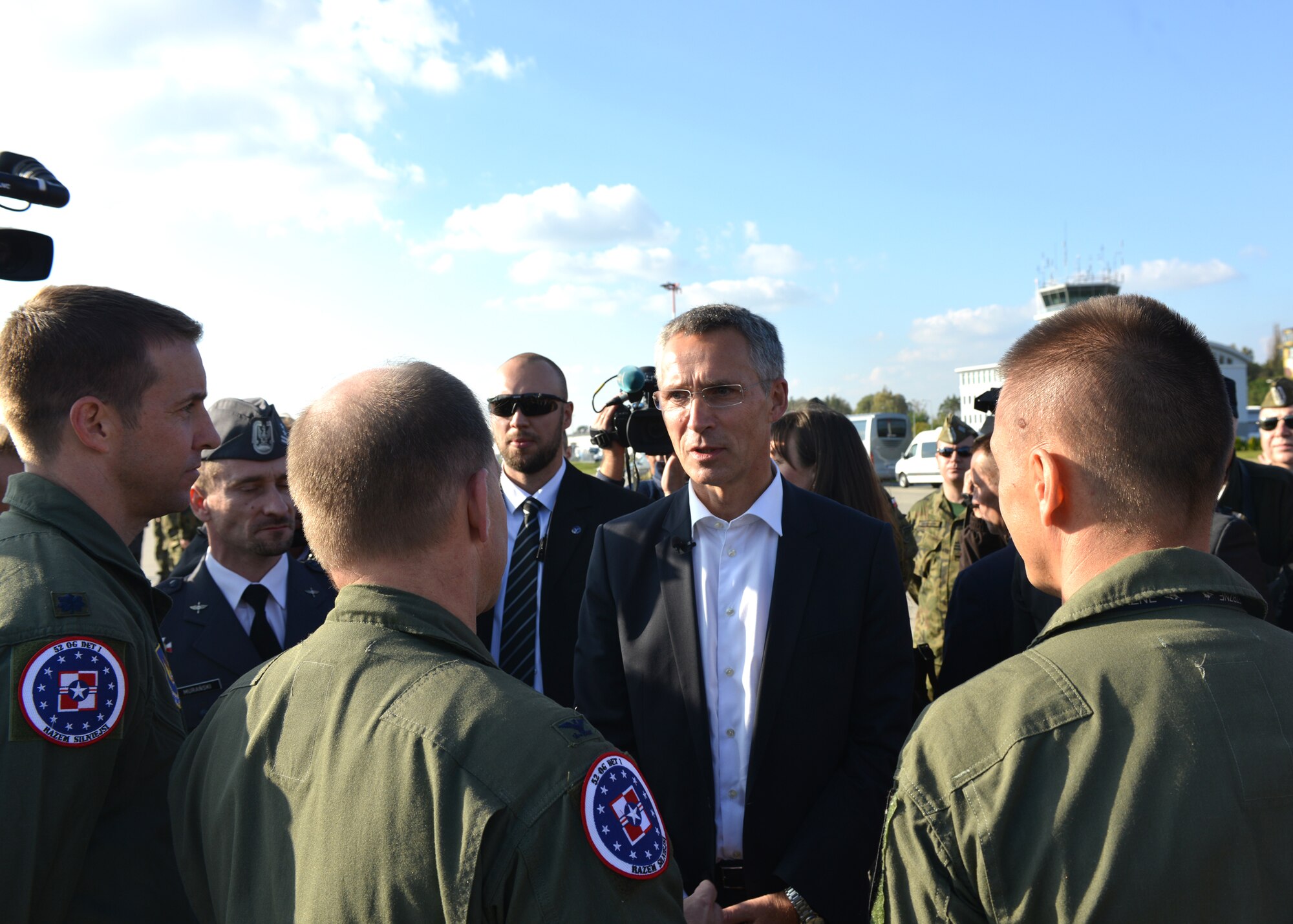 The new NATO Secretary-General Jens Stoltenberg speaks with U.S. Air Force Airmen Oct. 6, 2014, at Lask Air Base, Poland. During the visit, the secretary-general stressed the continued dedication to NATOs strong alliance. He also thanked the NATO allies in attendance to include the United States, Canada, Belgium, Poland, Netherlands, France and Germany in addition to all NATO partners for their dedication to the mission. (U.S. Air Force photo/Tech. Sgt. Eric Donner)