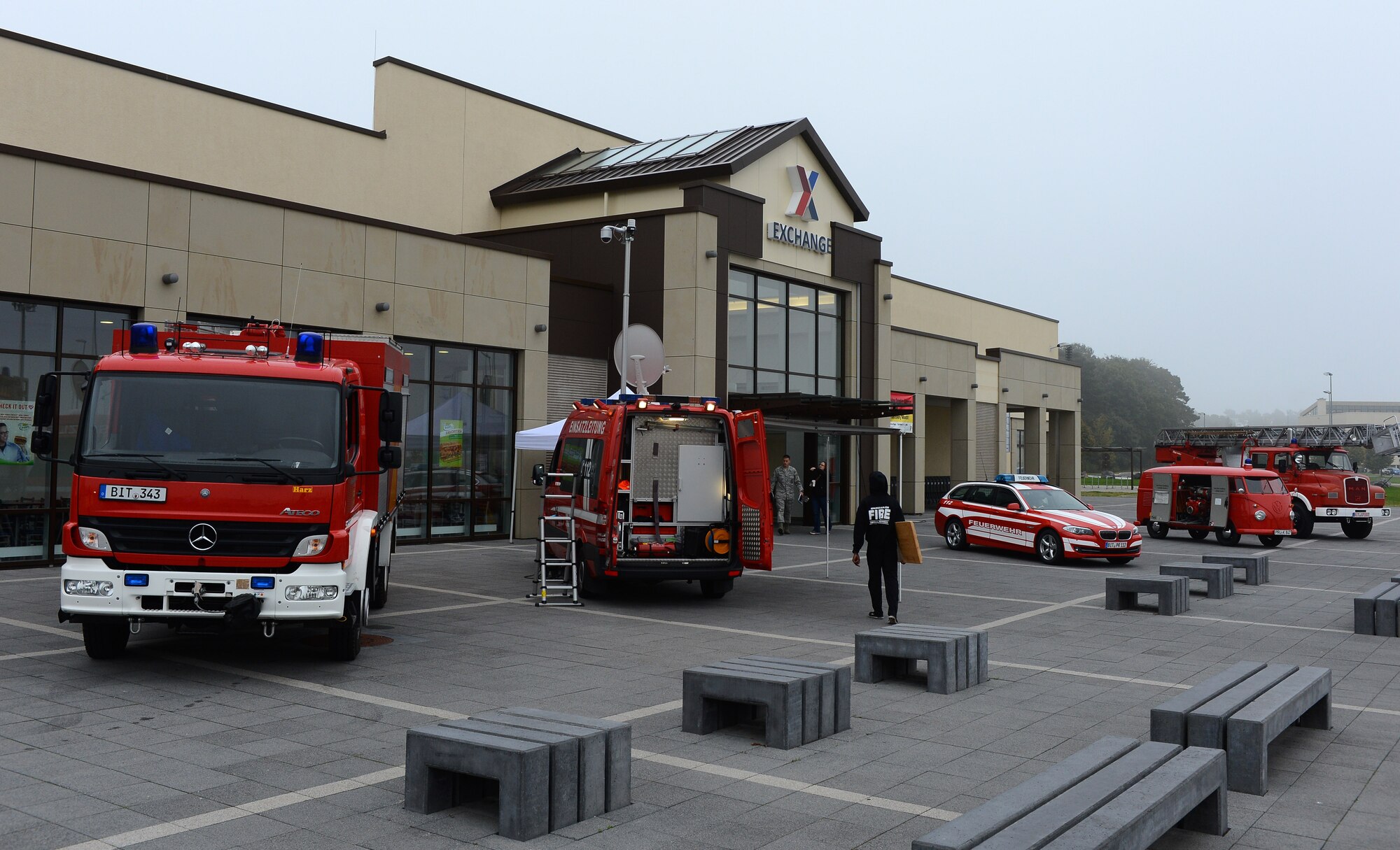 Five German fire-safety vehicles line up outside the Exchange for a Fire Muster Challenge at Spangdahlem Air Base, Germany, Oct. 6, 2014. This is Fire Prevention Week for Spangdahlem, and the Fire Muster Challenge was one of many events scheduled throughout the week. Other events include school visits and a commissary display. (U.S. Air Force photo by Airman 1st Class Luke J. Kitterman/Released) 