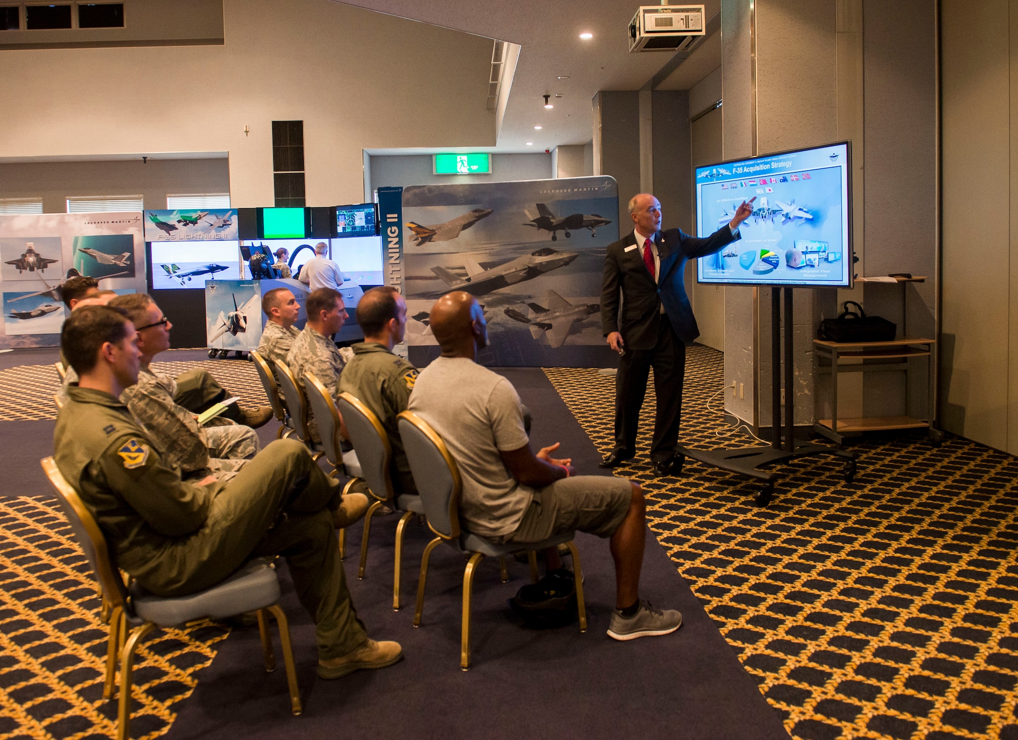 Bob DuLaney, Lockheed Martin F-35 Lightning II director of F-35 customer engagement, explains the capabilities of the aircraft at Yokota Air Base, Japan, Sept. 29, 2014. Some of the capabilities the F-35 has to offer is it's stealth, sensor information fusion and network-enabled operations. (U.S. Air Force photo by Airman 1st Class Meagan Schutter/Released)