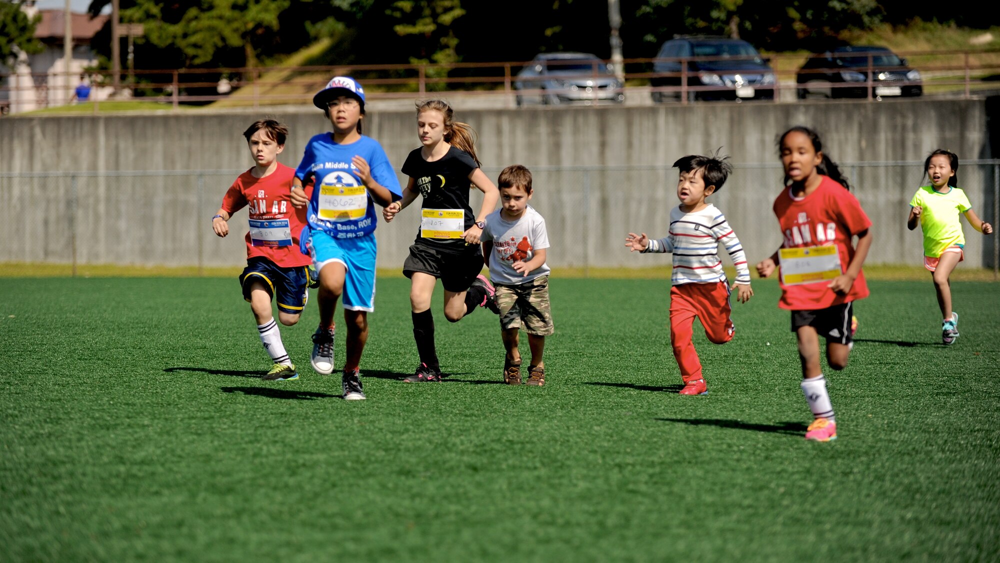 Children participate in a children's race during a Friendship Fun Run Oct. 4, 2014 at Osan Air Base, Republic of Korea.  In addition to the children's race, the run featured a half marathon, 10K, 5K and kids' relay.  The run was hosted by the 607th Air Operations Center and its Good Neighbors.  More than 300 U.S. and Korean participants registered for the run.  (U.S. Air Force photo by Maj. John Ross)