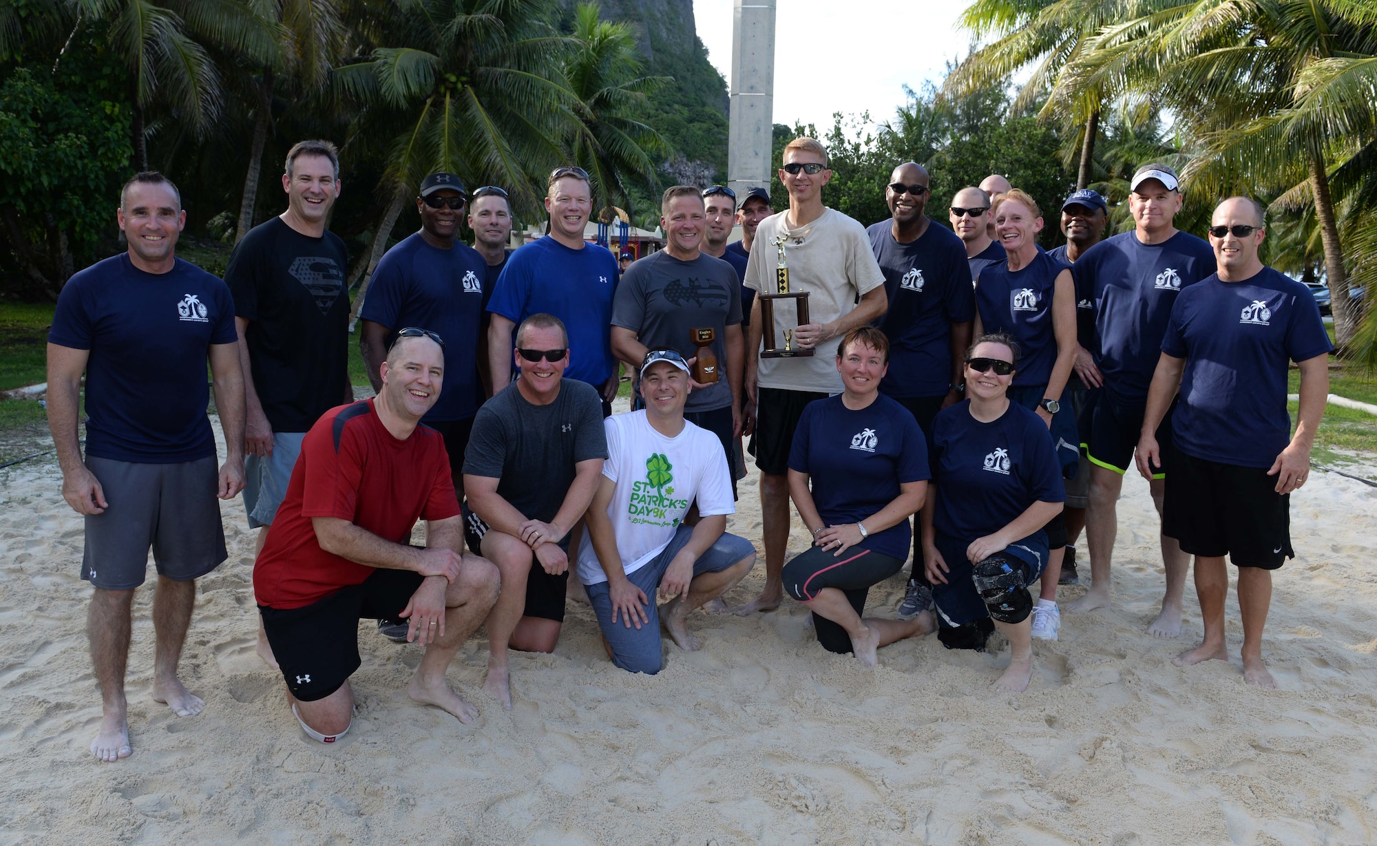 Team Andersen chief master sgts. and colonels gather together for a picture after the Chiefs vs. Eagles volleyball game Oct. 3, 2014, on Andersen Air Force Base, Guam. The Eagles beat the Chiefs in a  best two out of three tournament style volleyball game and secured possession of the trophy until the next event.  (U.S. Air Force photo by Senior Airman Katrina M. Brisbin/Released)