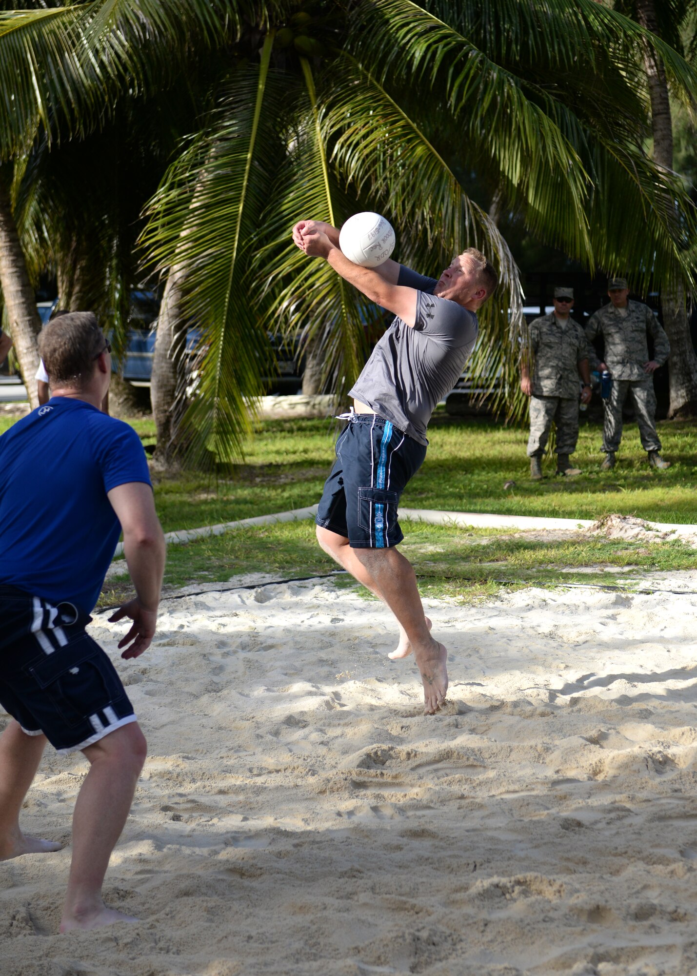 Col. Tyrell Chamberlain, 36th Wing vice commander, sets up a teammate during the Chiefs vs. Eagles volleyball game Oct. 3, 2014, on Andersen Air Force Base, Guam. The Eagles beat the Chiefs in a  best two out of three tournament style volleyball game and secured possession of the trophy until the next event. (U.S. Air Force photo by Senior Airman Katrina M. Brisbin/Released)