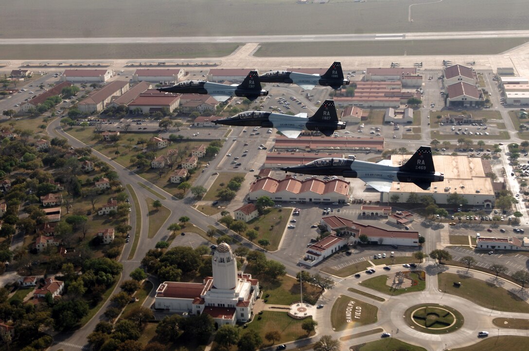 Four T-38 Talons fly over Randolph Air Force Base, Texas, March 27 for the 35th anniversary reunion of the "Freedom Flyers." These former prisoners of war return to Randolph each year and three of them flew back seat during the mission. The aircraft are from the 560th Flying Training Squadron. (U.S. Air Force photo/Master Sgt. Scott Reed)