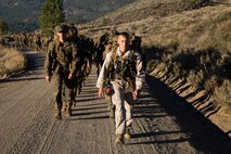 Sergeant Douglas Smith, a unit leader at the Marine Corps Mountain Warfare Training Center, Bridgeport, California, leads Marines from Combat Logistics Battalion 6 and 2nd Battalion, 5th Marine Regiment on a three-mile hike from lower base camp to Landing Zone Quail, where they will recieve classes the mountainous environment. Marines from CLB-6 and 2/5 attended the Summer Mountain Exercise aboard Matine Corps Mountain Warfare Training Center that spans a total of 21 says and teaches them how to survive in trecherous mountain terrain. (U.S. Marine Corps photo by LCpl. Preston McDonald/Released)