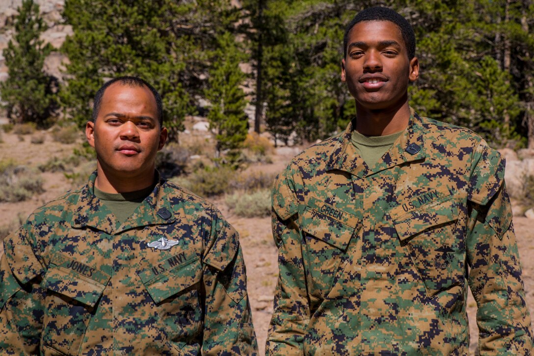Petty Officer 2nd Class Kenneth Jones and PO3 Diamond Green pose for a photo, Oct. 4. PO2 Jones and PO3 Green, hospital corpsmen with Combat Logistics Battalion 6, along with fellow Marines, rushed to the aid of a man who had been injured in a motorcycle accident. CLB-6 and Weapons Company, 2nd Battlion, 5th Marine Regiment were conducting training at Sardine Rock, Marine Corps Mountain Warfare Center in Bridgeport, California, on Oct. 4, when a passing vehicle requested help after they had come upon the scene of a motorcycle accident. The Green and Jones selflessly responded and helped stabilize the man before he was rushed to a hospital via a care flight unit. (U.S. Marine Corps photo by LCpl. Preston McDonald/Released)