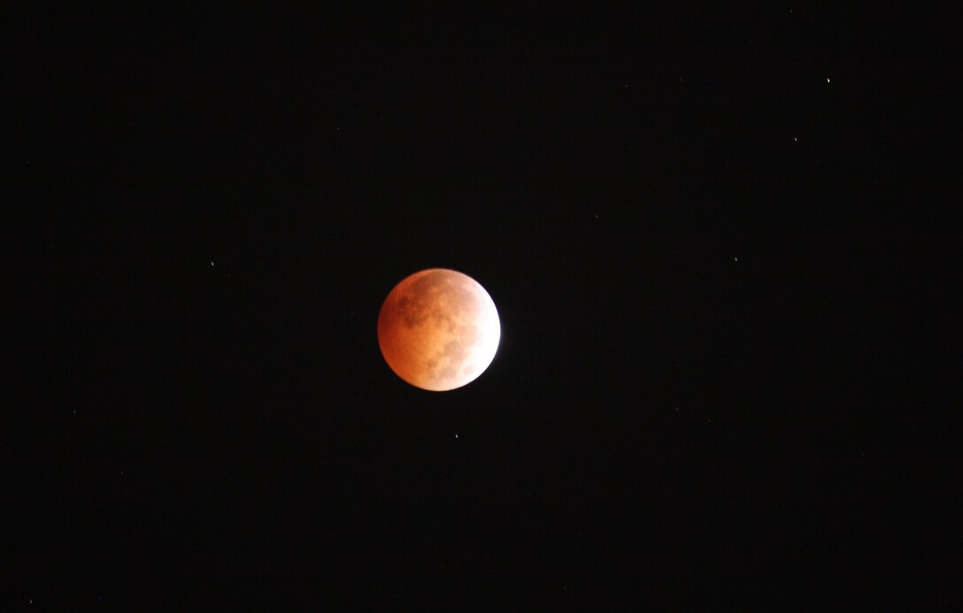 The Oct. 8, 2014, lunar eclipse seen from McAlpine Locks and Dam on the Ohio River at Louisville, Ky. 