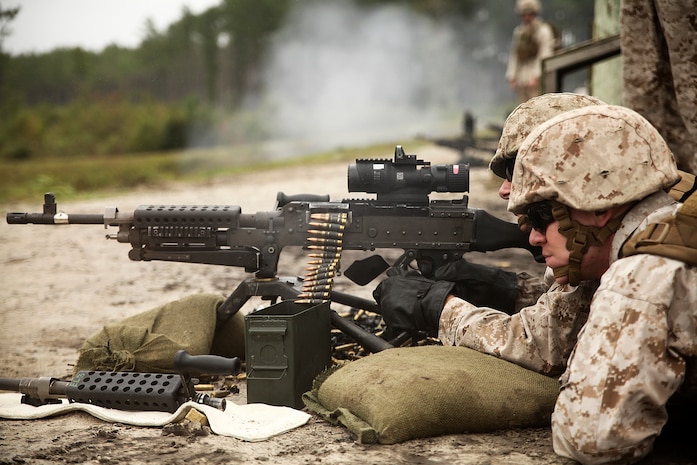 A Marine with 2nd Maintenance Battalion, 2nd Marine Logistics Group, fires an M240B machine gun at unknown-distance targets at SR8 Multi-purpose Machine Gun Range aboard Marine Corps Base Camp Lejeune, N.C., Sept. 26, 2014.  Marines conducted live-fire exercises with the M240B machine gun to maintain proficiency and build confidence using the weapons system. Marines and sailors with the battalion conducted a field exercise Sept. 18-Oct. 1, 2014, to reinforce their ability to accomplish battalion-level, mission essential tasks.