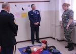 Maj. Gen. Steven Cray and State Command Sgt. Maj. Toby Quick receive a briefing from a soldier in the Army of the Republic of Macedonia. Macedonia's Army Medical Unit has Role 2 medical capabilities and will probably be the focus of the tri-lateral engagement between Macedonia and Senegal, Vermont's two State Partnership Program countries, Sept. 22, 2014. 