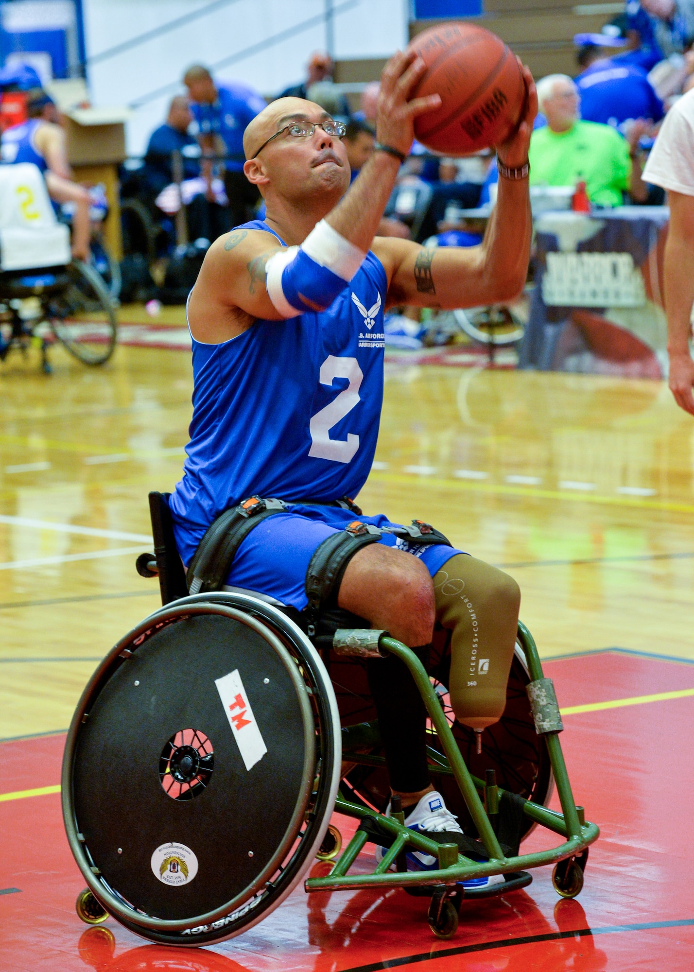 Master Sgt. Christopher Aguilera warms up before a game against Navy in the first wheelchair basketball game of the 2014 Warrior Games Sept. 29, 2014, at the U.S. Olympic Training Center in Colorado Springs, Colo. The Air Force team lost 38-19 and will play the U.S. Special Operations Command in the next round. (U.S Air Force photo/Staff Sgt. Devon Suits) 
