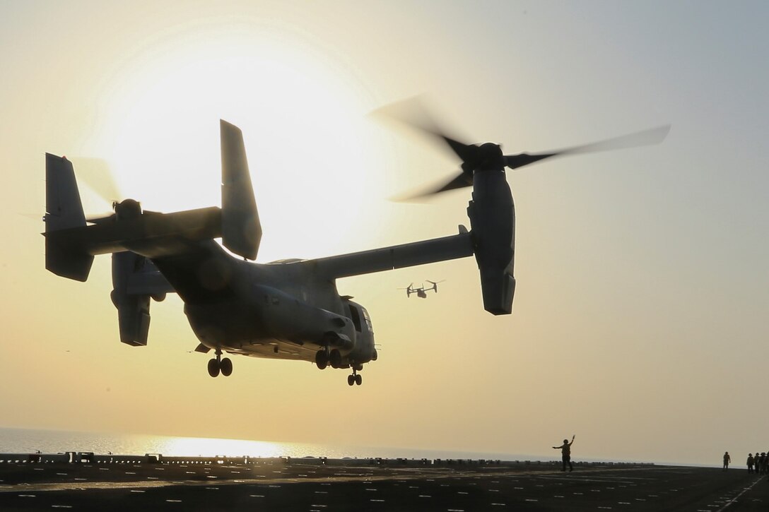 MV-22B Ospreys with Marine Medium Tiltrotor Squadron 163 (Reinforced), 11th Marine Expeditionary Unit (MEU), take off from the flight deck of the USS Makin Island to support ongoing operations, Oct. 6.  The Makin Island Amphibious Ready Group (ARG) and the embarked 11th MEU are deployed in support of maritime security operations and theater security cooperation efforts in the U.S. 5th Fleet area of responsibility.  (U.S. Marine Corps photo by Cpl. Laura Y. Raga/ RELEASED)
