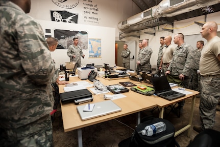 Air Force Lt. Col. Bruce Bancroft of the Kentucky Air National Guard’s 123rd Contingency Response Group talks to unit members about their role in Operation United Assistance during a briefing in the Joint Operations Center at Léopold Sédar Senghor International Airport in Dakar, Senegal, Oct. 5, 2014. The Kentucky Air Guard members stood up an Intermediate Staging Base at the airport that will funnel humanitarian supplies and equipment into West Africa as part of the international effort to fight Ebola. 