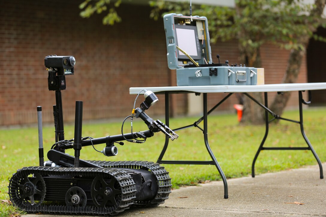 Marines with Explosive Ordnance Disposal Company, 8th Engineer Support Battalion, 2nd Marine Logistics Group, provided a class and demonstration on some of their robots to the students of Lejeune High School, Oct. 3, 2014, aboard Marine Corps Base Camp Lejeune, N.C. Approximately 60 students, ranging from freshmen to seniors, packed the classroom to hear how the Marines use robotics on the battlefield and how engineering can better people’s lives. The school requested the Marines give the demonstration because the students are beginning their robotics curriculum of the Bio-Tech Department course of study. (U.S. Marine Corps photo by Cpl. Michael Dye / Released)
