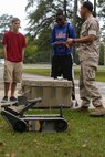 Staff Sgt. Samuel Beltram, the training chief with Explosive Ordnance Disposal Company, 8th Engineer Support Battalion, 2nd Marine Logistics Group, and a native of Fort Worth, Texas,  explains the importance of thinking ahead while using robots to students at Lejeune High School, Oct. 3, 2014 aboard Marine Corps Base Camp Lejeune, N.C.  Approximately 60 students, ranging from freshmen to seniors, packed the classroom to hear how the Marines use robotics on the battlefield and how engineering can better people’s lives. The school requested the Marines give the demonstration because the students are beginning their robotics curriculum of the Bio-Tech Department course of study. (U.S. Marine Corps photo by Cpl. Michael Dye / Released)